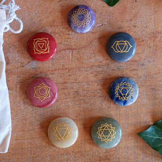 Bring balance and focus to your spiritual practice with this Seven Chakra Crystal Stone Set. Featuring seven natural crystal discs, each engraved with the symbol of a different chakra, this set is ideal for meditation, crystal therapy, yoga and other spiritual practices.