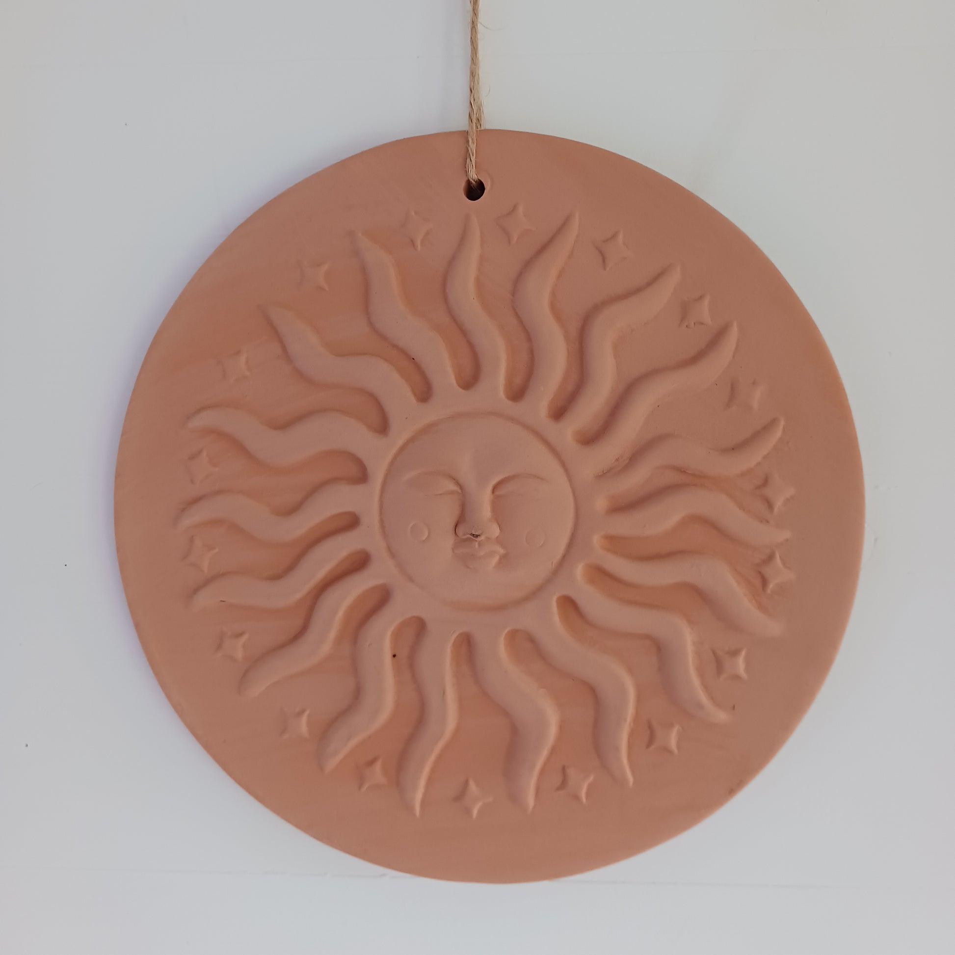 The Terracotta Sun Plaque brings warmth, balance, and positive energy to gardens and sacred outdoor spaces. 