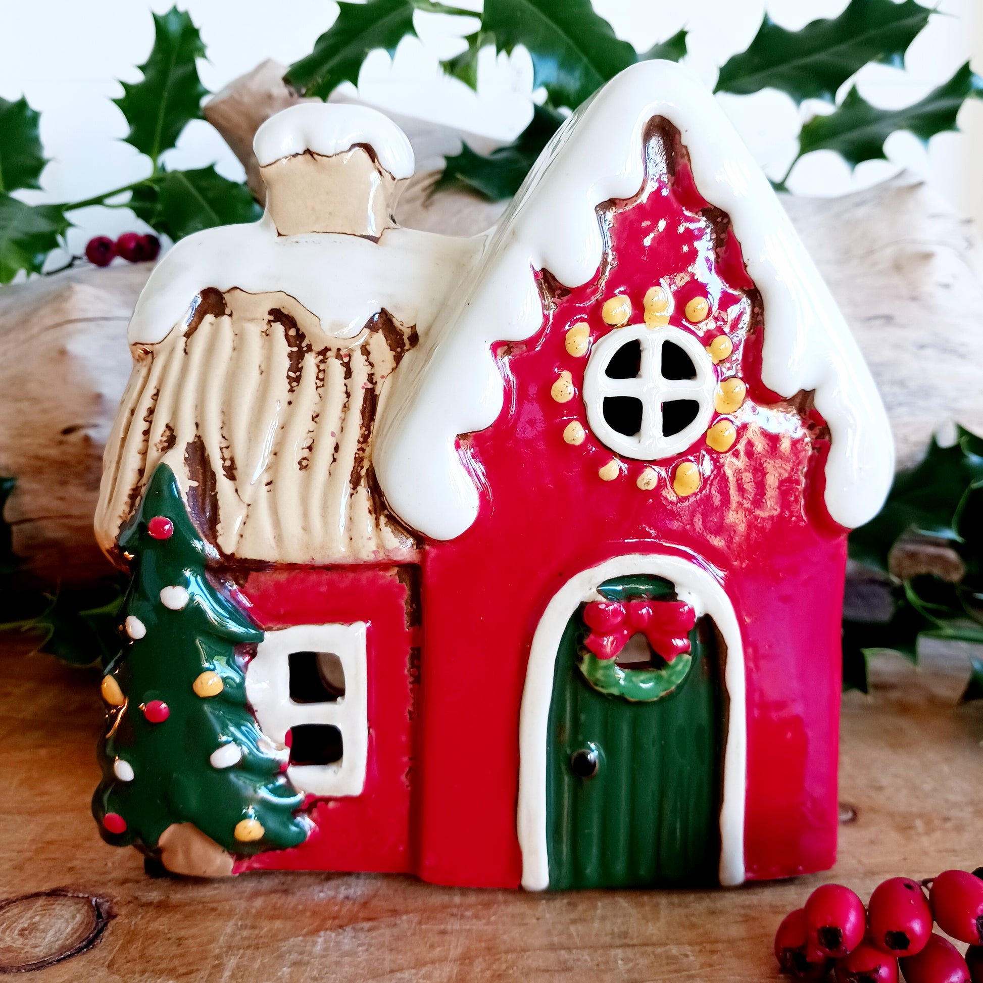 Fill your home with the warmth and wonder of the season with the Village Pottery Christmas Round Window House Tealight Holder, a beautifully handcrafted ceramic creation glowing with festive spirit. Measuring 14.5 x 13.5 x 8.5 cm, this charming house captures the cosy magic of a winter’s night, where light glows softly through the rounded windows like starlight in the snow.