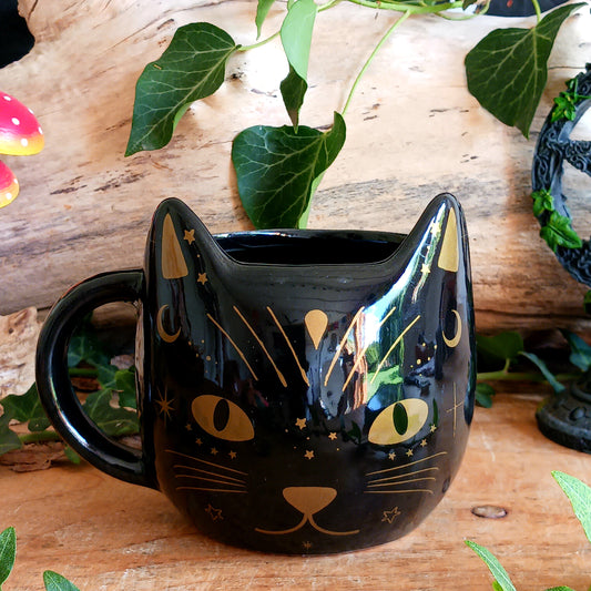 Bring a little everyday magick to your morning routine with this stylish Black Cat Magick Mug. Featuring a striking black cat design, this ceramic mug is perfect for enjoying tea, coffee, hot chocolate, or your favourite warm drink while embracing your love of gothic décor and mystical symbolism.