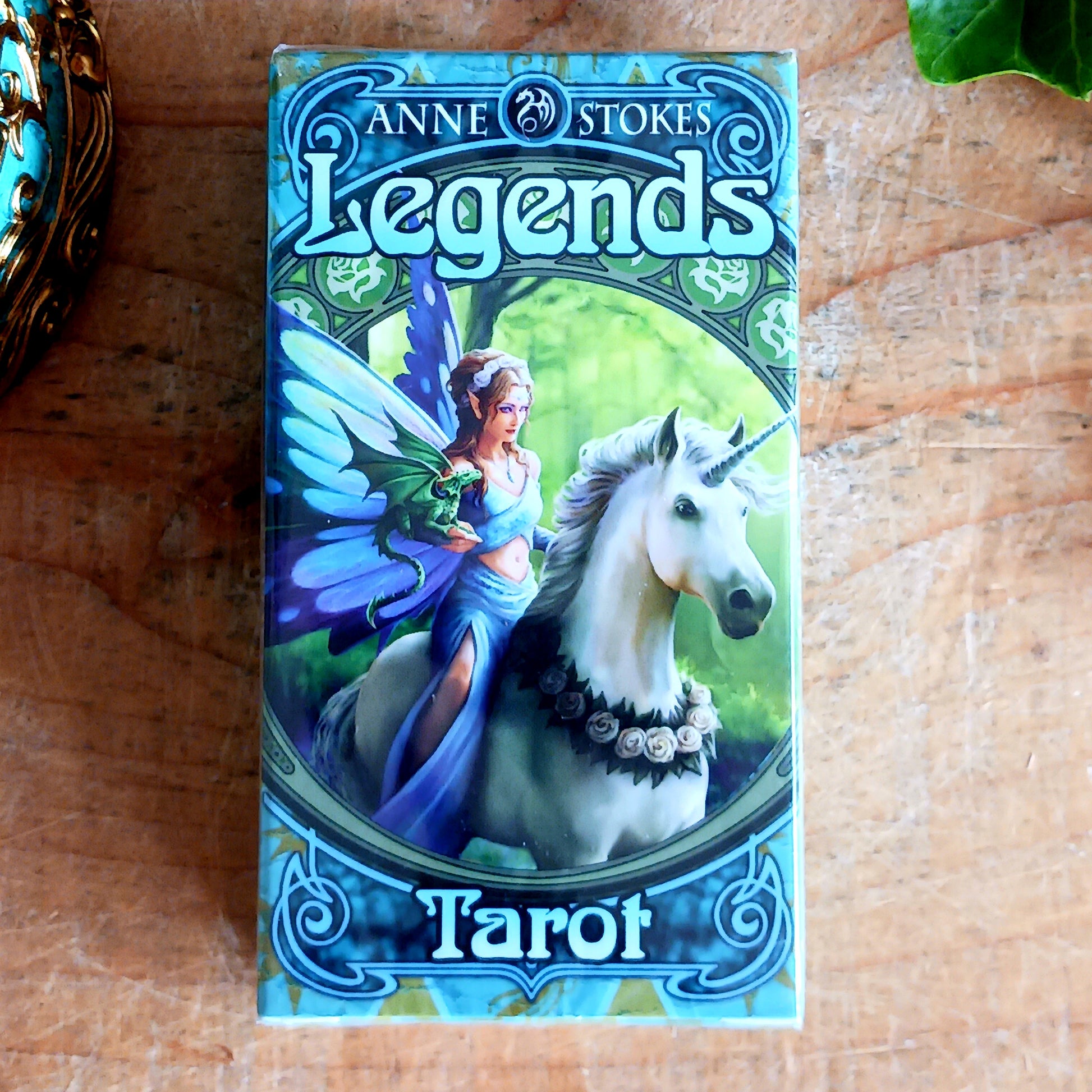 Step into a mystical world of magic and myth with The Legends Tarot Deck, featuring the captivating artwork of renowned fantasy artist Anne Stokes. This beautifully crafted deck includes 78 traditional tarot cards—22 Major Arcana and 56 Minor Arcana—each adorned with Anne’s enchanting illustrations of magical beings, mythical creatures, and otherworldly realms.