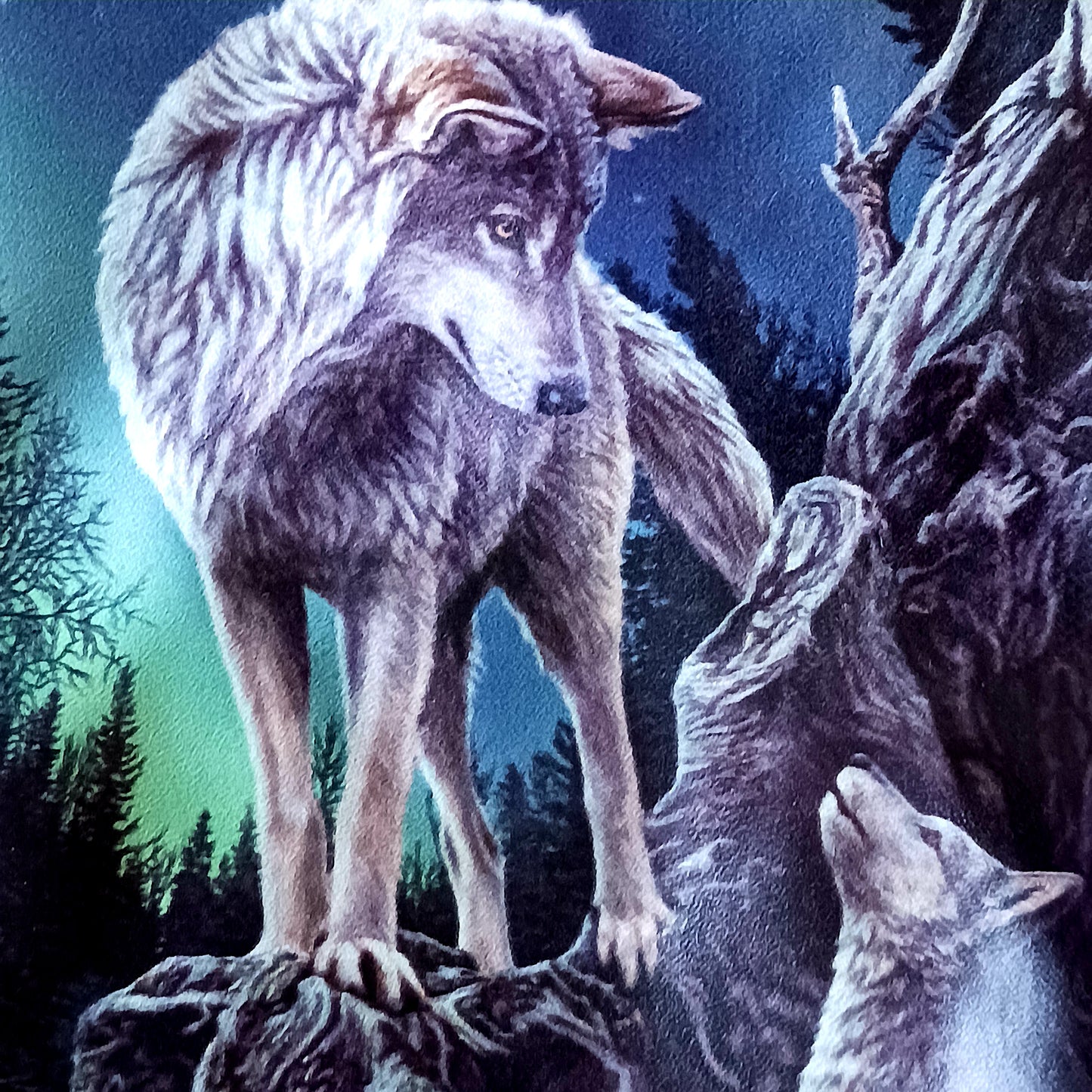 Step into a world of magic, guidance, and untamed wilderness with this stunning Lisa Parker Wolf & Pup Shoulder Bag, from Nemesis Now. Featuring enchanting artwork from the renowned fantasy and wildlife artist Lisa Parker, this bag captures a tender moment beneath a starlit sky as a majestic wolf watches protectively over their pup beneath the glowing aurora borealis.