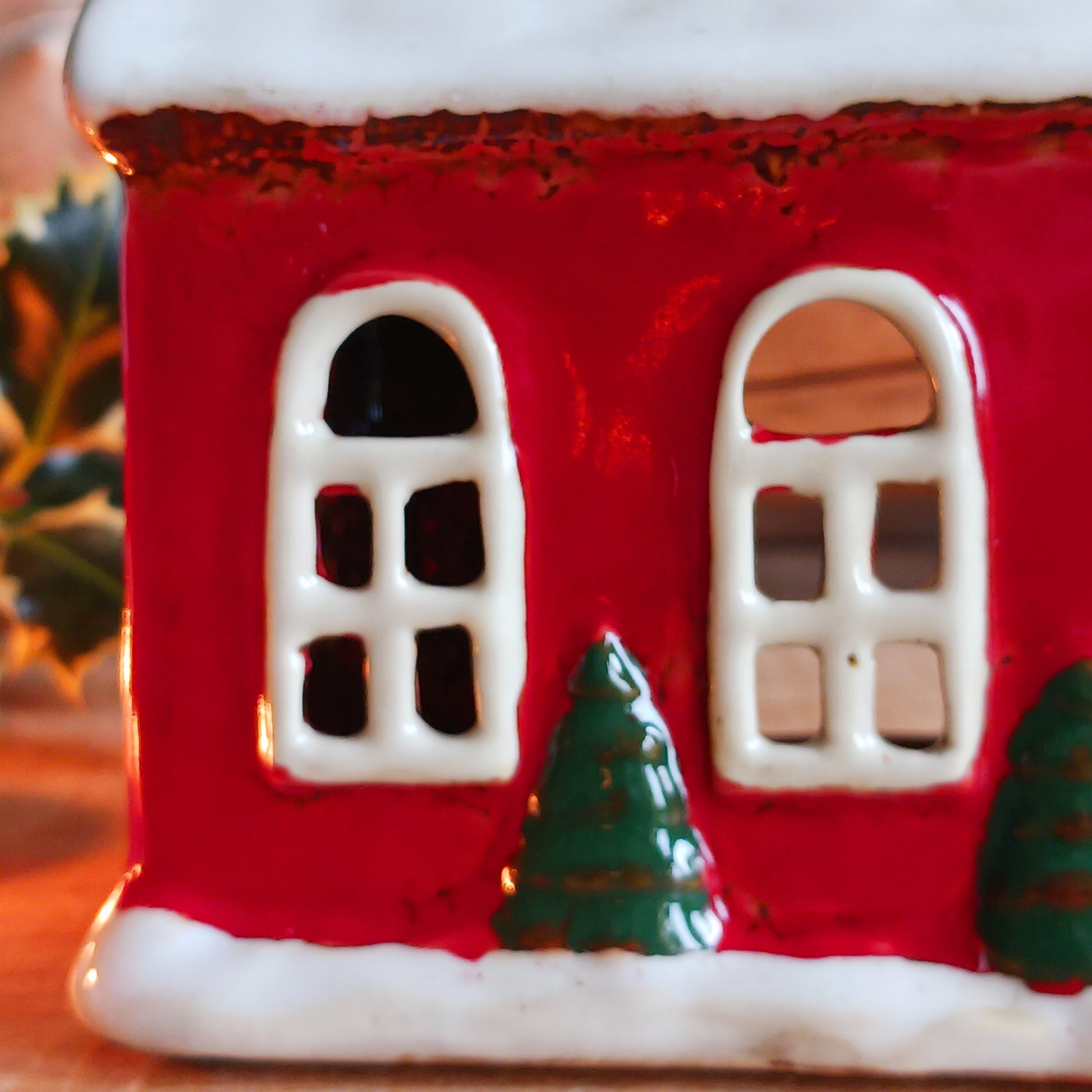 Bring festive warmth to your home with the Large Christmas Church Tealight Holder from the Village Pottery collection. This beautifully handcrafted ceramic piece features rustic detailing, evoking the charm of a snow-covered church glowing softly with candlelight.