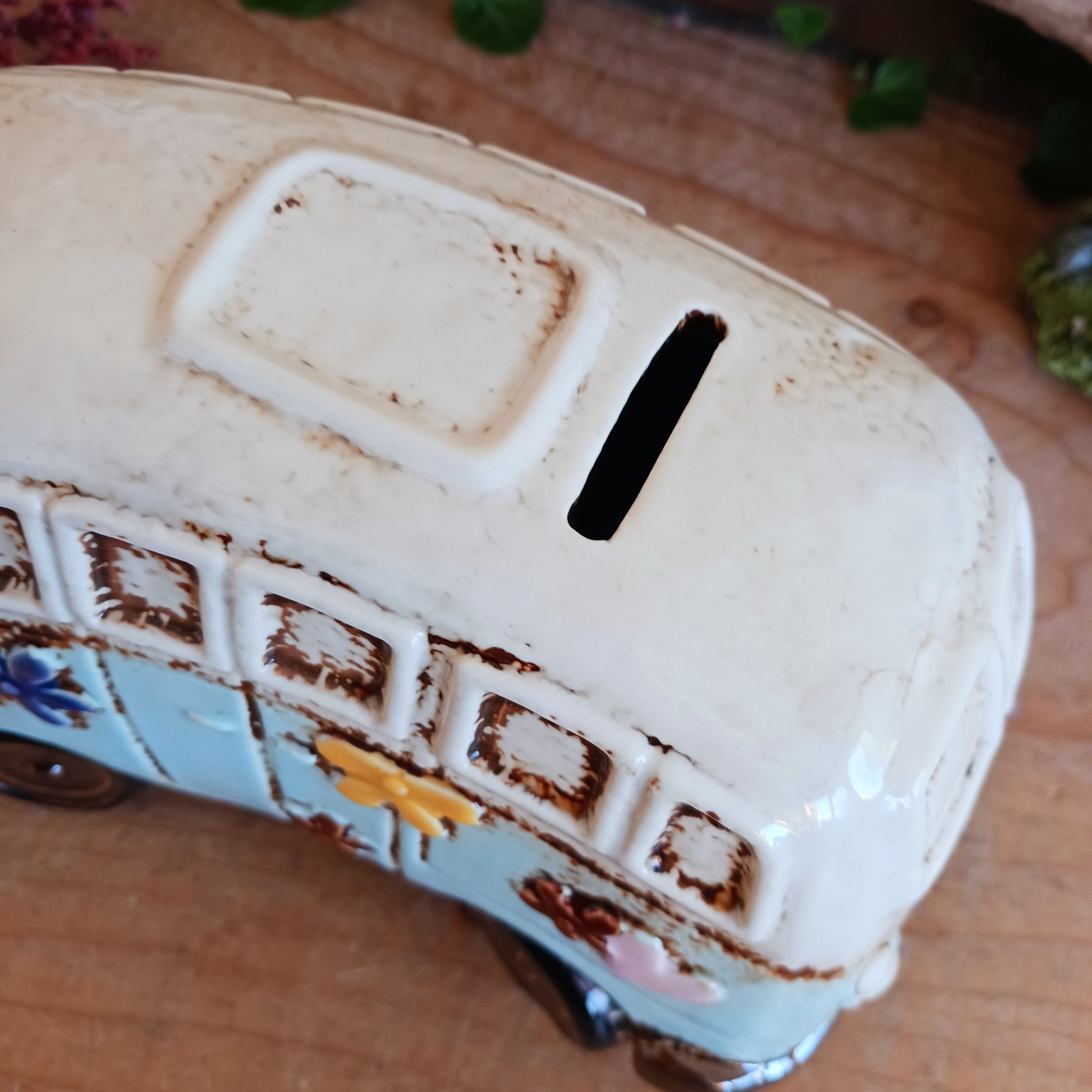 From the enchanted lanes of Village Pottery comes this Aqua VW Campervan Money Box, a charming ceramic treasure crafted for dreamers and wanderers alike. Measuring 11 x 18.5 x 10cm, this delightful piece captures the spirit of adventure with its soft aqua glaze, vintage VW Campervan design, and hand-painted detailing that feels kissed by fairy dust.