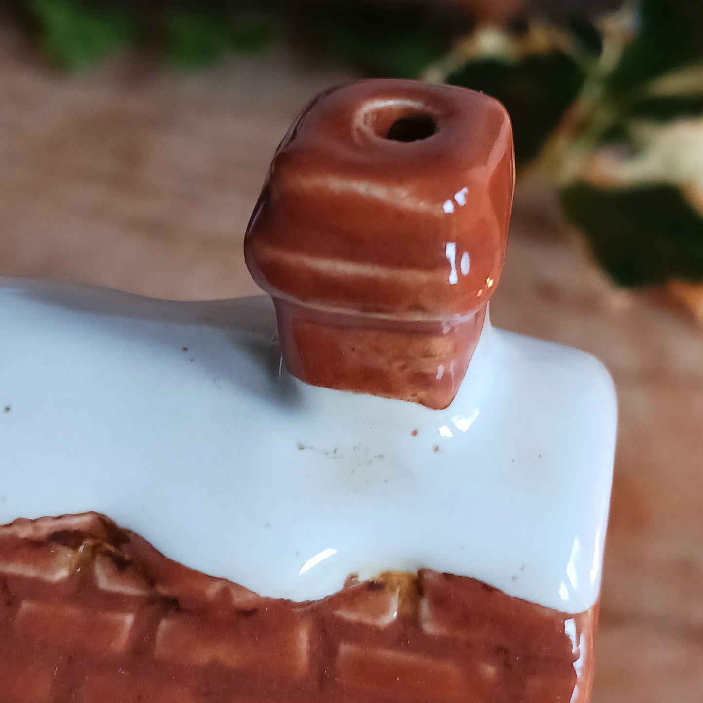 Bring nostalgic festive charm to your home with our Christmas Toy Shop Ceramic Tealight Holder, handcrafted in the Village Pottery workshop. This detailed tealight house captures the magic of an old-world toy shop on a snowy winter’s evening. 