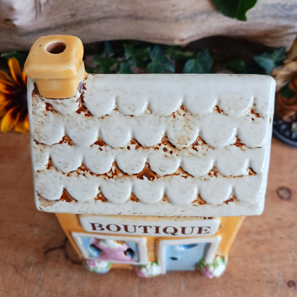 Bring a little village charm into your home with this delightful Village Pottery Boutique Tealight Holder. Hand-crafted in ceramic and beautifully hand-painted, this charming miniature shop makes a lovely decorative feature both with or without a candle.
