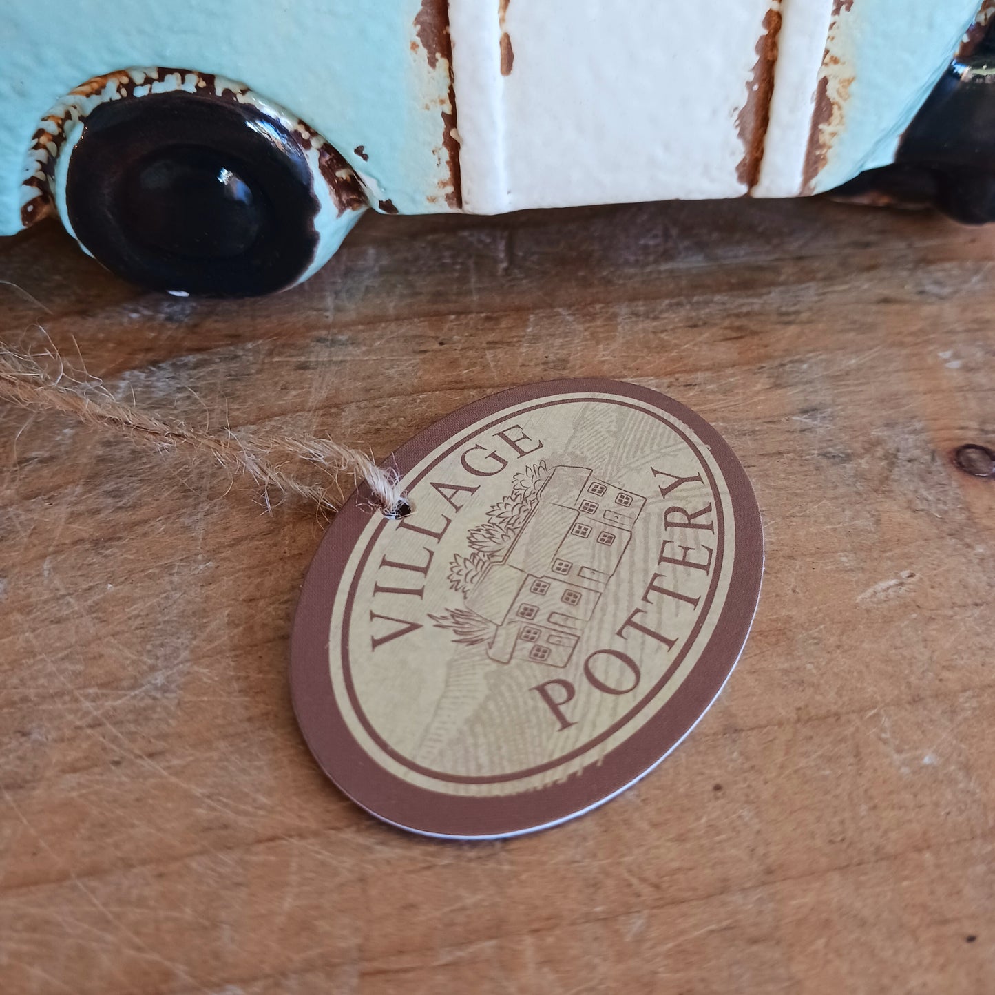 From the enchanted lanes of Village Pottery comes this Aqua Caravan Money Box, a charming ceramic treasure crafted for dreamers and wanderers alike. Measuring 13.5 x 18.5 x 6.5 cm, this delightful piece captures the spirit of adventure with its soft aqua glaze, vintage caravan design, and hand-painted detailing that feels kissed by fairy dust.