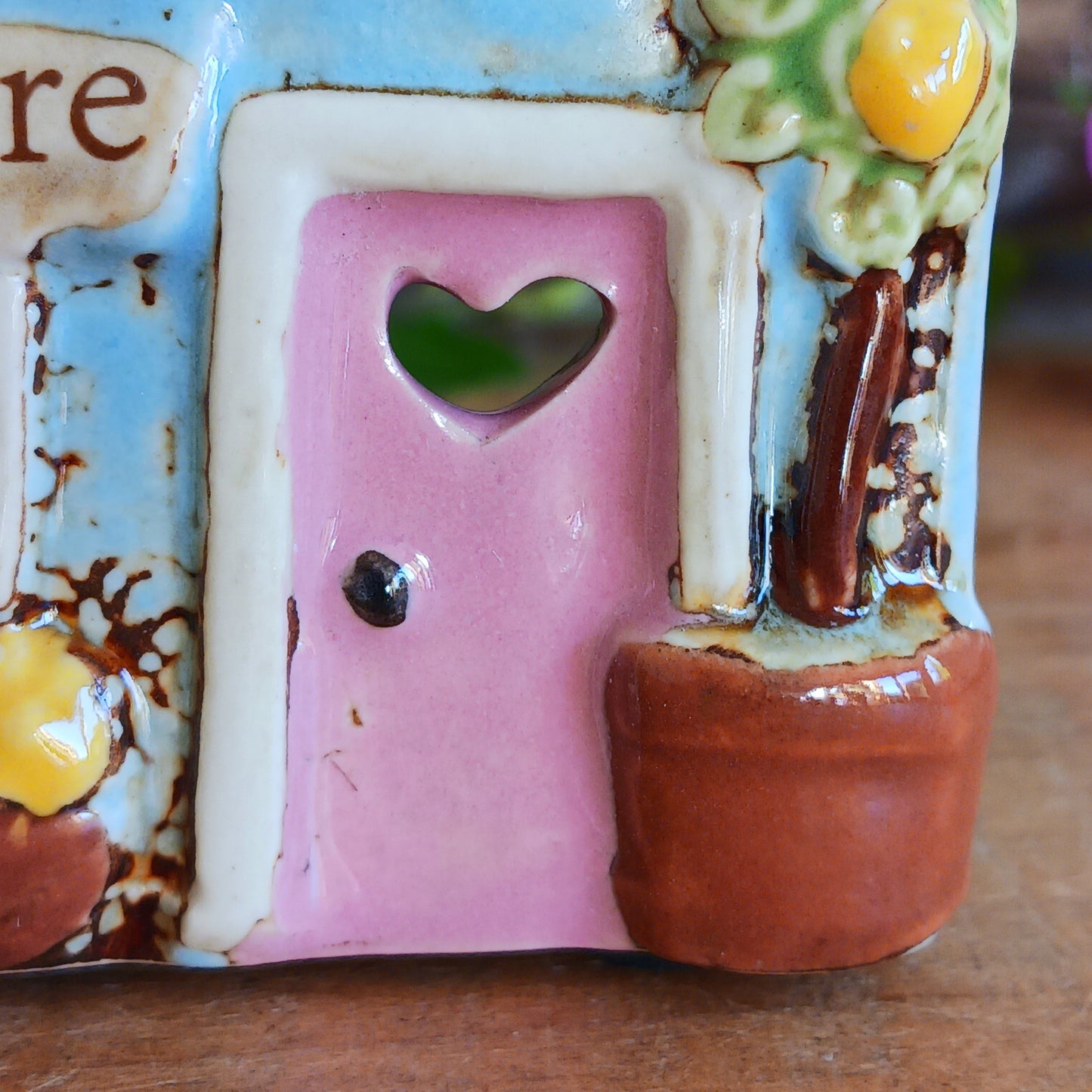 Welcome a touch of storybook charm into your home with the Village Pottery Village Stores Tealight Holder, a handcrafted ceramic delight glowing with the warmth of simpler times. Measuring 15.5 x 9.5 x 8 cm, this quaint miniature shop captures the heart of an old-fashioned village, complete with detailed windows, rustic roof tiles, and painted signage that evokes cosy nostalgia.