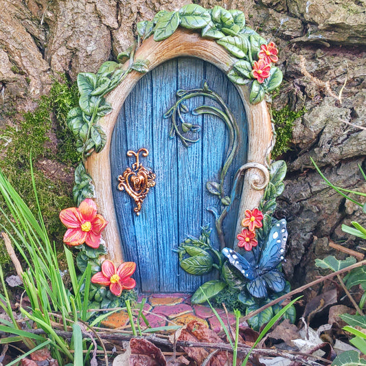 Bring a touch of magic to your home or garden with this beautifully crafted blue fairy door, designed to spark imagination and enchant any space.