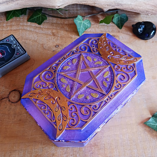 Add a touch of mystical charm to your home with this beautiful Purple Triple Moon Jewellery Box. Featuring the symbolic Triple Moon design, this enchanting decorative box celebrates feminine energy, lunar cycles and spiritual transformation. Finished in rich purple and gold, it makes a striking addition to any altar, bedside table or sacred space.