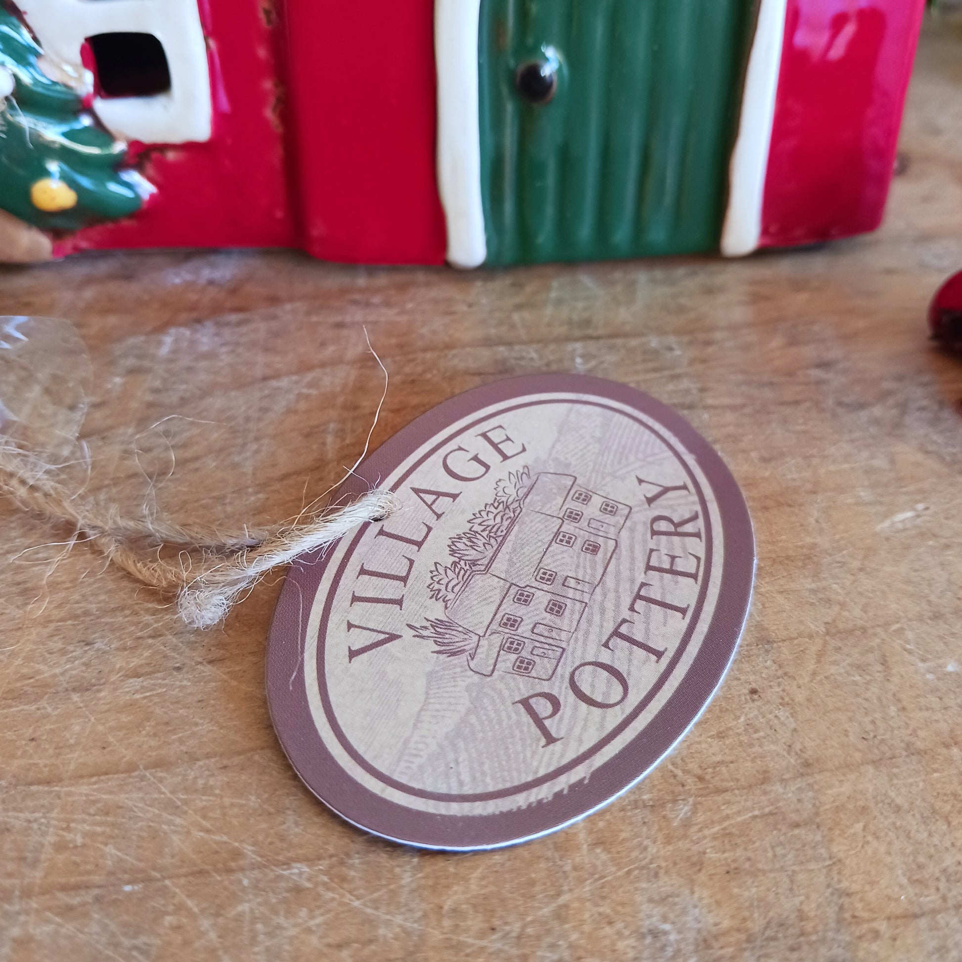 Fill your home with the warmth and wonder of the season with the Village Pottery Christmas Round Window House Tealight Holder, a beautifully handcrafted ceramic creation glowing with festive spirit. Measuring 14.5 x 13.5 x 8.5 cm, this charming house captures the cosy magic of a winter’s night, where light glows softly through the rounded windows like starlight in the snow.