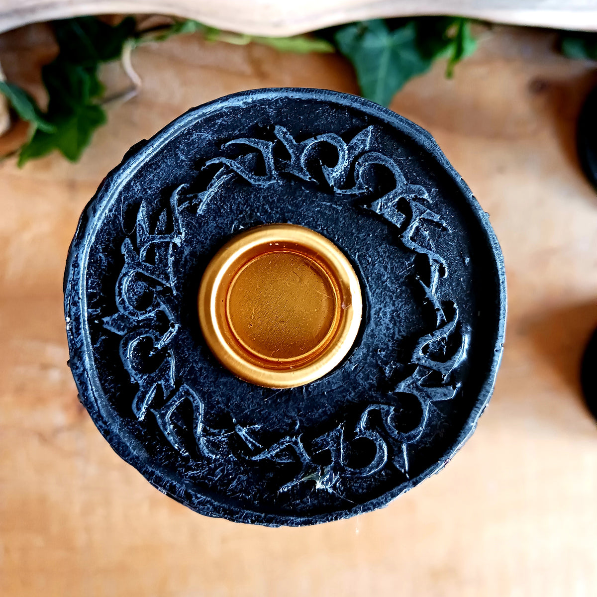 Add a touch of dark elegance to your home with the Midnight Rose Gothic Candlestick Holder. Beautifully crafted with a stone pillar design, this striking ornament features intricate black roses and dark vegetation, creating a mysterious gothic aesthetic that makes a statement in any room.
