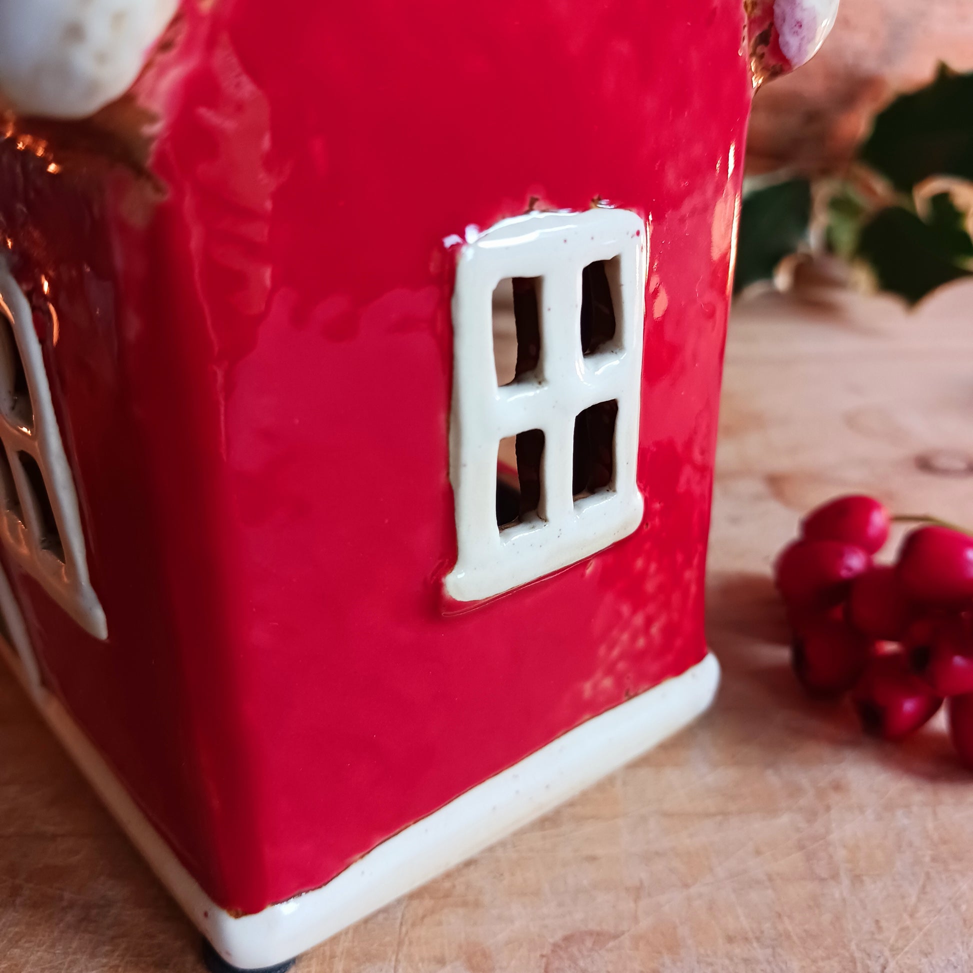 Bring timeless festive charm to your home with this hand-crafted Christmas Traditional House Tealight Holder from The Village Pottery. Carefully shaped in ceramic and finished with rustic detailing, it captures the magic of a snow-covered village scene. 