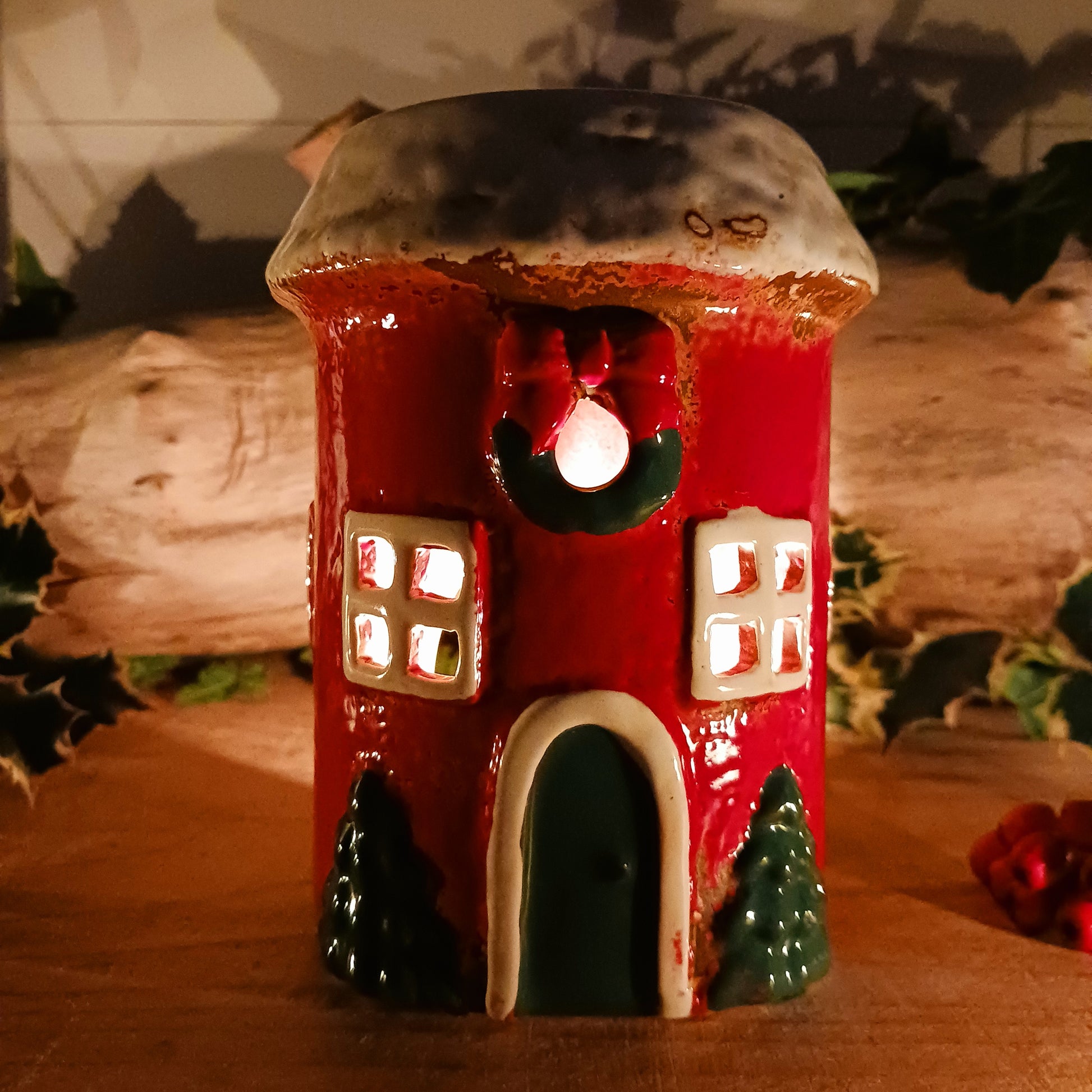 Bring timeless holiday charm to your home with this Handcrafted Christmas Oil Wax Warmer by Village Pottery. Designed in the shape of a festive wreath, this ceramic warmer combines beauty and practicality for the holiday season. Perfect for wax melts or essential oils, it creates a warm and inviting atmosphere as the fragrance fills your space.