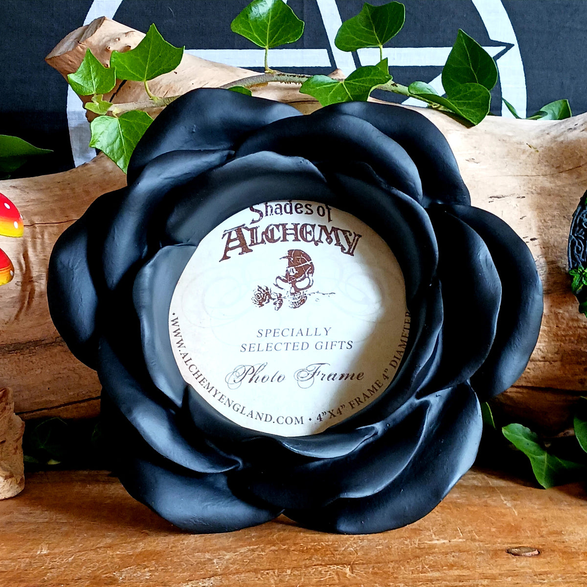 Add a touch of dark romance to your home with the Night Rose Photo Frame. Shaped like a blooming rose, this striking black resin picture frame features beautifully layered petals that create a sculptural floral border around your favourite photograph.