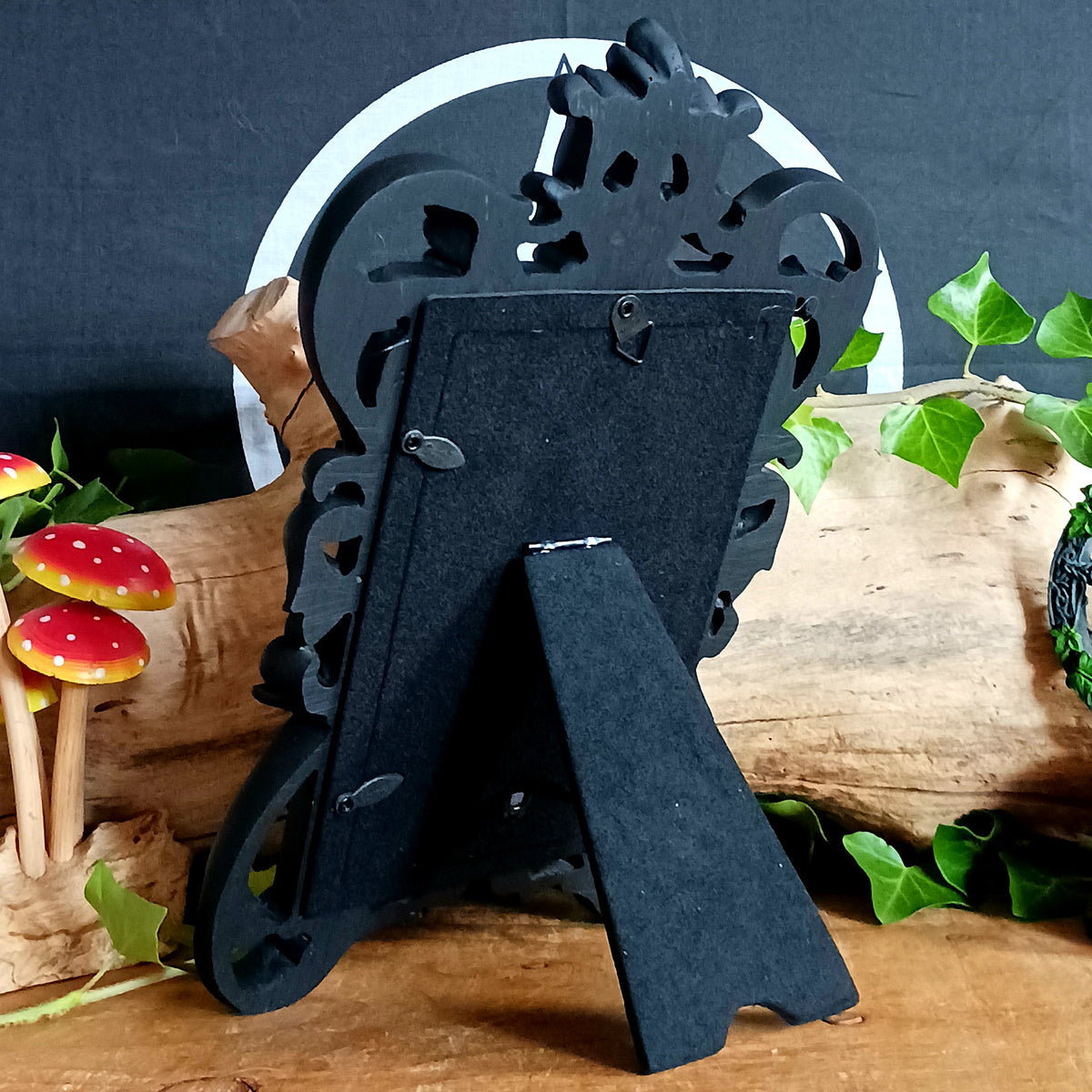 Add a touch of dark elegance to your home with this ornate Black Rococo Photo Frame. Inspired by the opulence of a bygone era, this decorative resin frame features elaborate scrollwork, flowing curves and a dramatic black finish, creating a striking statement piece for gothic, vintage and alternative interiors.