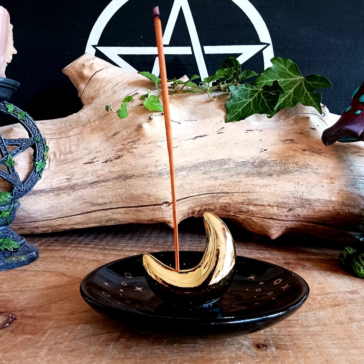 Harness the night’s enchantment with the Gold Crescent Moon Incense Stick Holder. Crafted from smooth ceramic, this elegant crescent-shaped holder captures falling ash with ease while your favourite incense releases its alluring aroma. Perfect for your altar, bedside table, or meditation space, it infuses every corner with a spellbinding, celestial energy.