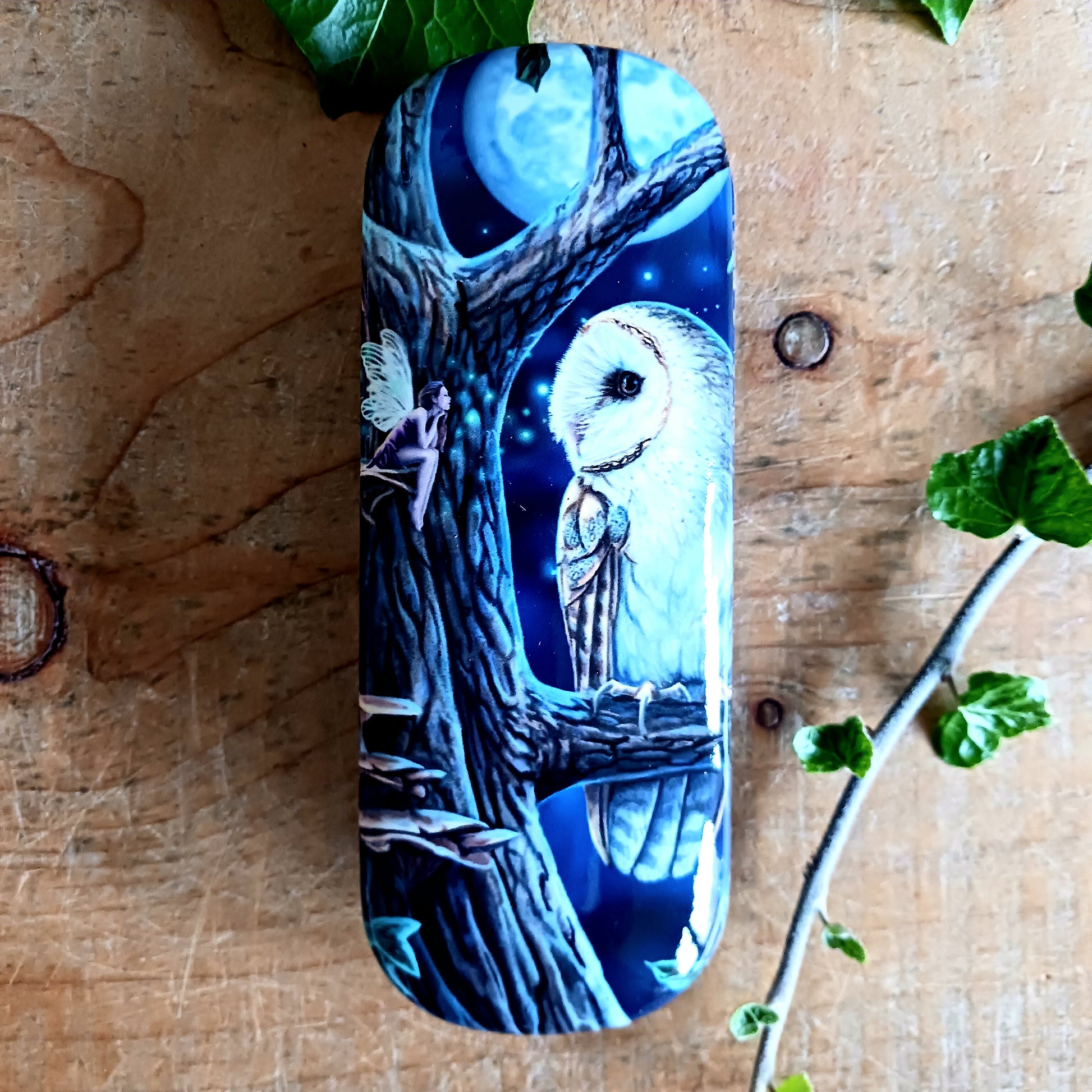 Protect your glasses with a touch of magic using this enchanting Lisa Parker Fairy Tales Glasses Case. Featuring the captivating Fairy Tales artwork by renowned fantasy artist Lisa Parker, this case is brought to life with a vibrant, high-quality print that adds mystical charm to your everyday essentials.