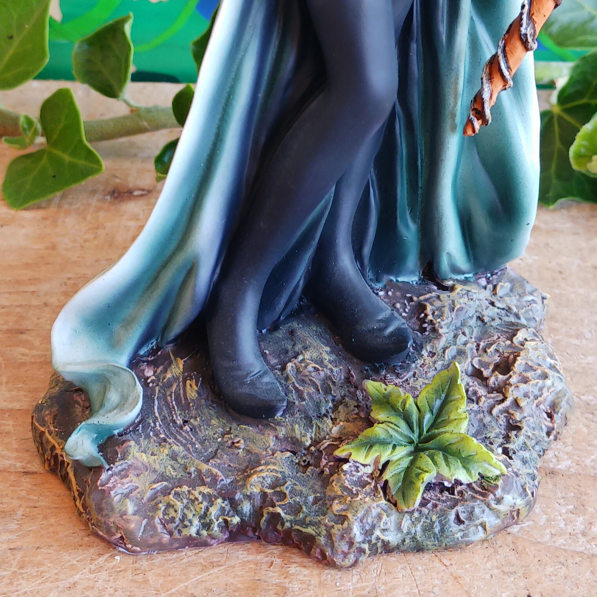 Meet Forest Fae, the whimsical guardian of the woods. This stunning standing fairy figurine captures the perfect blend of natural beauty and kawaii charm. Hand-painted with exquisite detail, she wears a lush forest green outfit, accented by leaf-shaped brooches, and holds a mystical staff crowned with a purple jewel. 