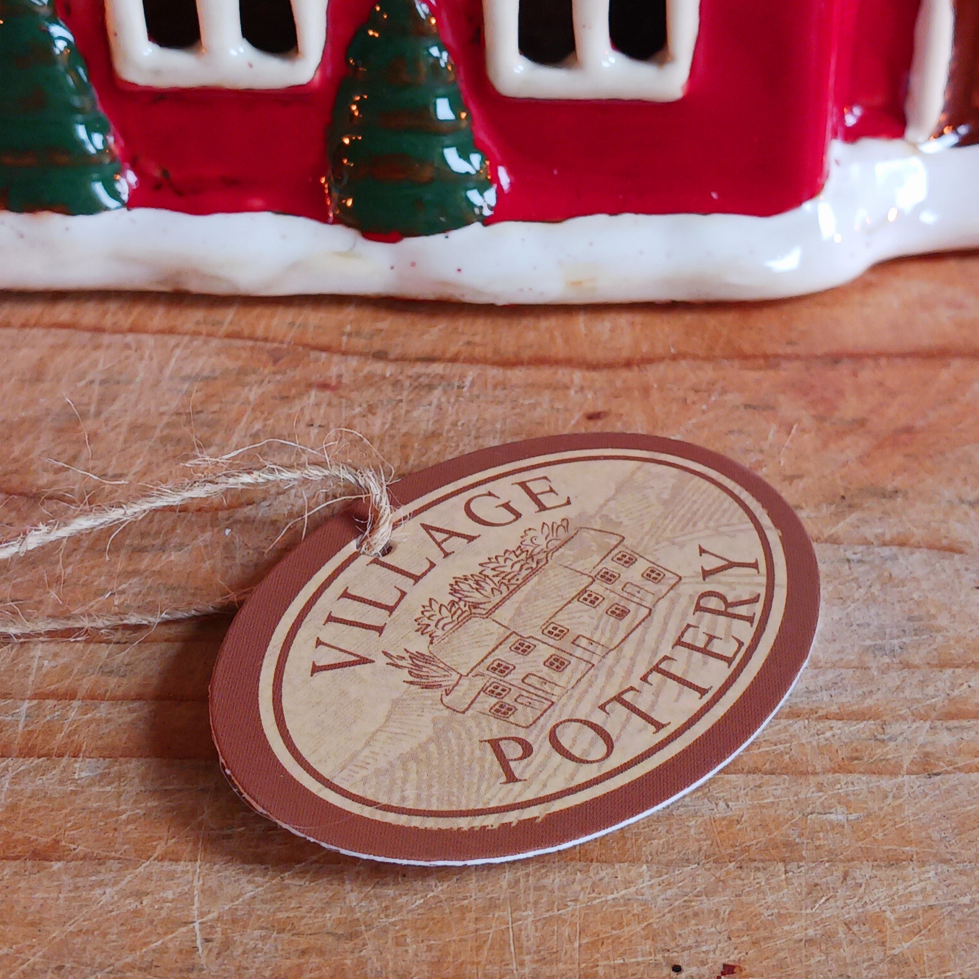 Bring festive warmth to your home with the Large Christmas Church Tealight Holder from the Village Pottery collection. This beautifully handcrafted ceramic piece features rustic detailing, evoking the charm of a snow-covered church glowing softly with candlelight.