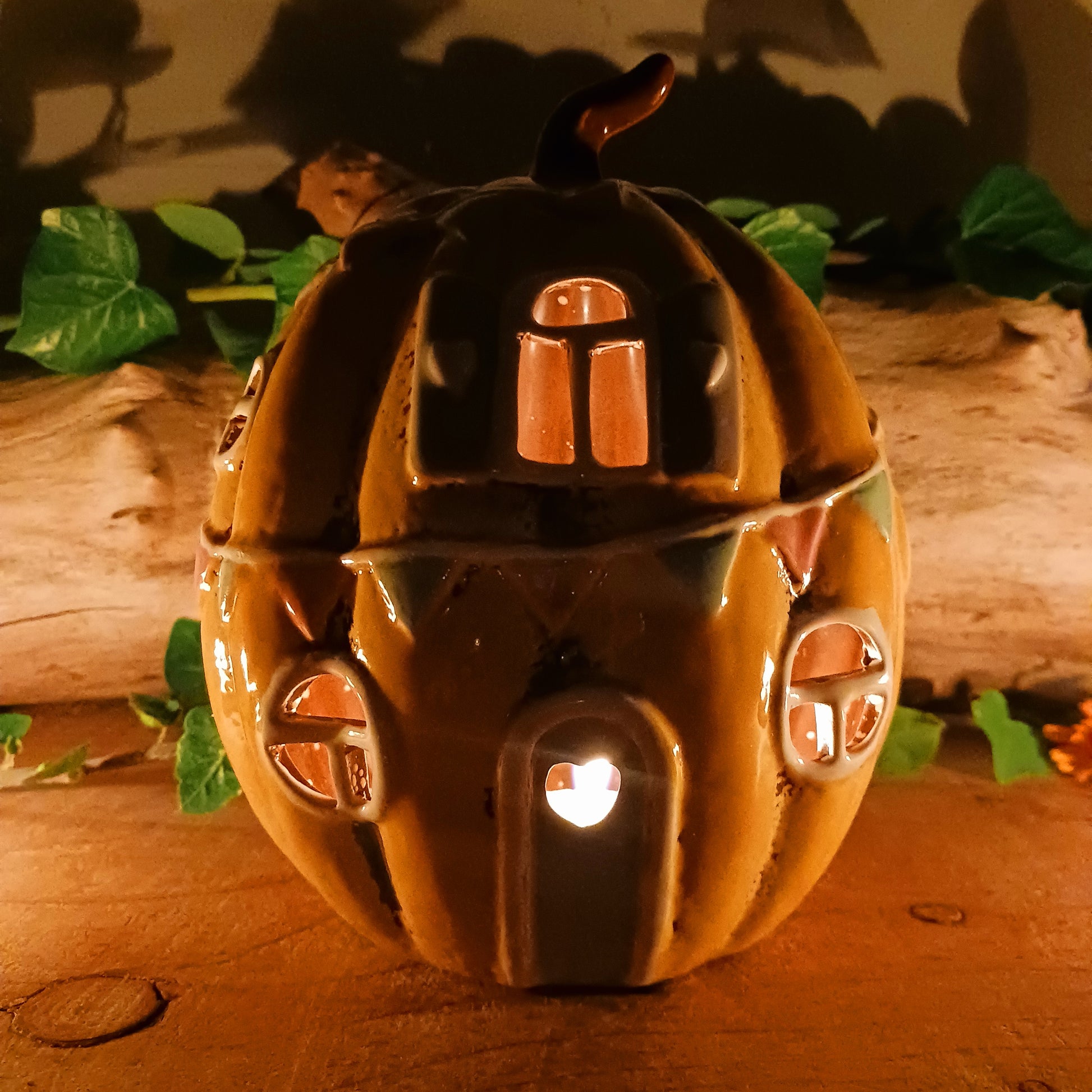 Invite a little woodland wonder into your home with the Village Pottery Pumpkin House Tealight Holder, a delightful hand-painted creation in a soft yellow ceramic glaze. Measuring 17 x 13 x 11 cm, this fairy-tale pumpkin cottage glows beautifully when lit, filling your space with warmth, light, and a touch of enchantment.
