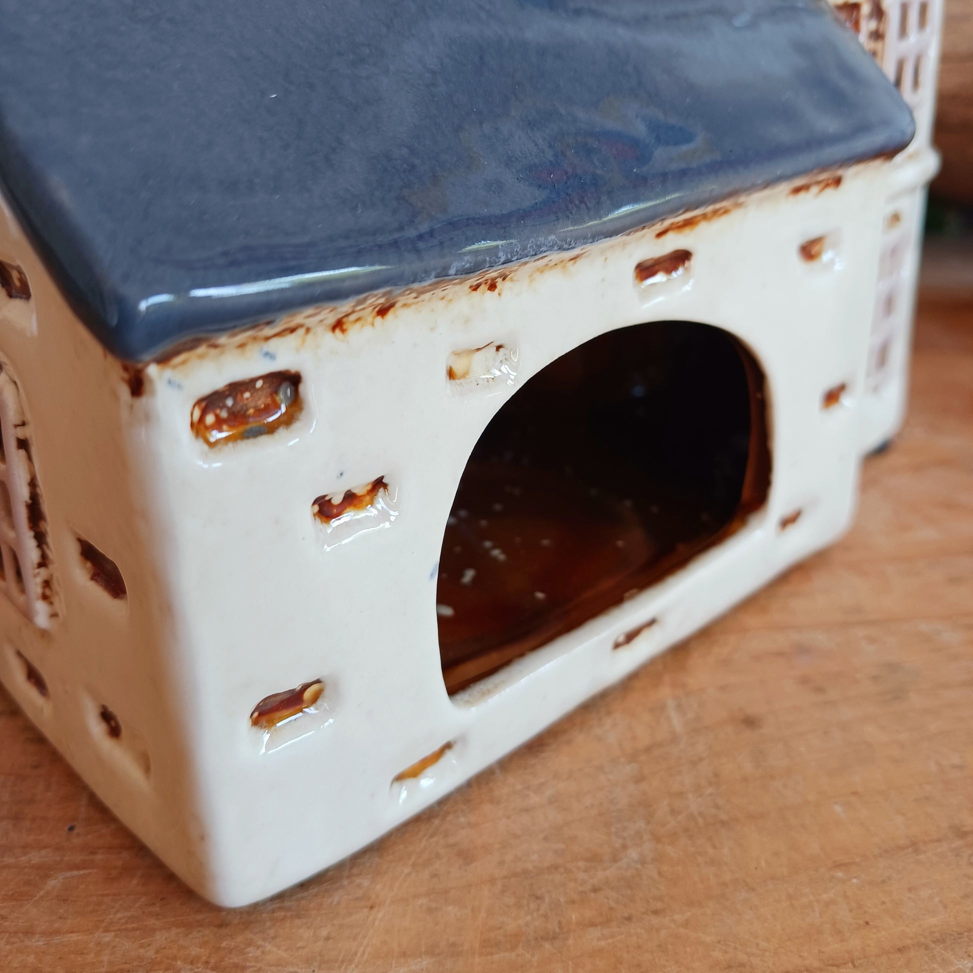 Add timeless charm to your home with the Village Pottery Steeple Church Tealight Holder. Beautifully hand-finished, each ceramic piece is unique and full of character. When a tealight is placed inside, a warm, cosy glow shines through the delicate church windows, creating a magical ambiance. 