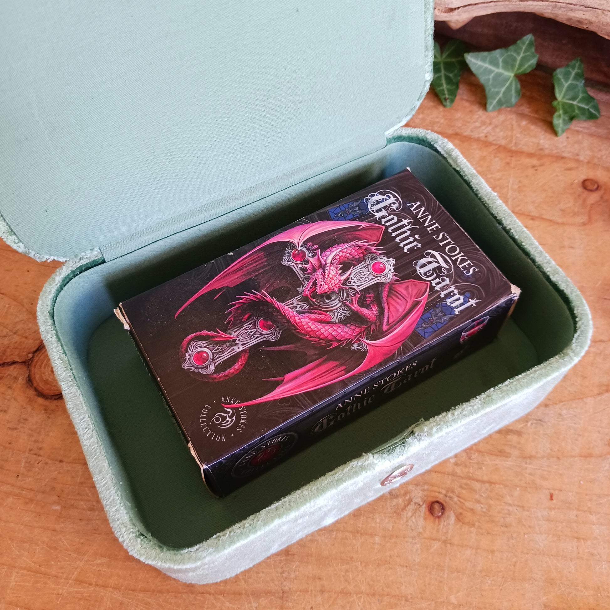 Elegant green triple moon velvet box with fine embroidery and beads. Perfect for jewellery, tarot cards, and crystals. Secure strap closure for treasured items.