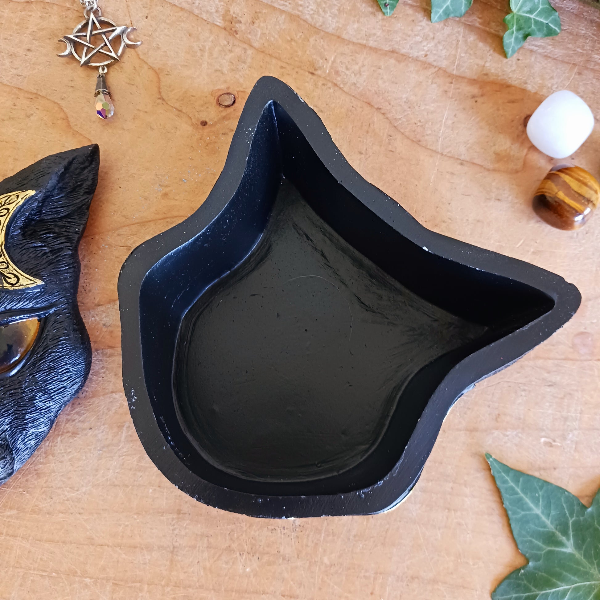 This enchanting Black Cat Triple Moon Trinket Box is the perfect blend of mystery and elegance. Featuring a striking black cat face with piercing eyes on the lid, it’s adorned with intricate, hand-painted gold triple moon designs. 