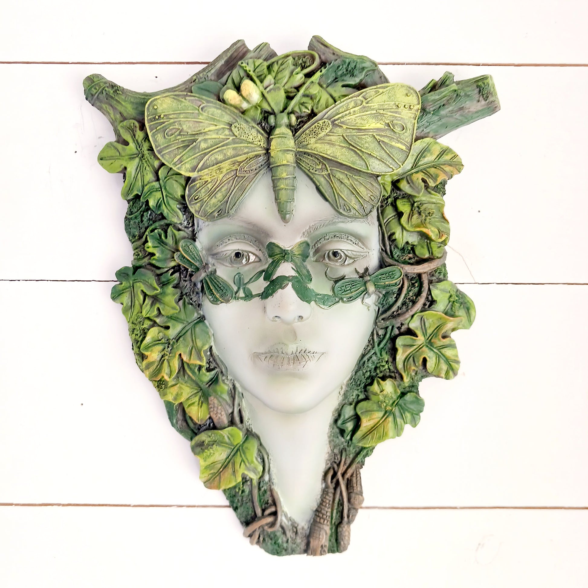 Bring the enchanting beauty of the forest into your home or garden with this stunning Green Goddess Resin Wall Plaque. Beautifully crafted with intricate leafy details, twisting branches and a striking butterfly crown, this decorative plaque captures the spirit of nature, growth and feminine energy.