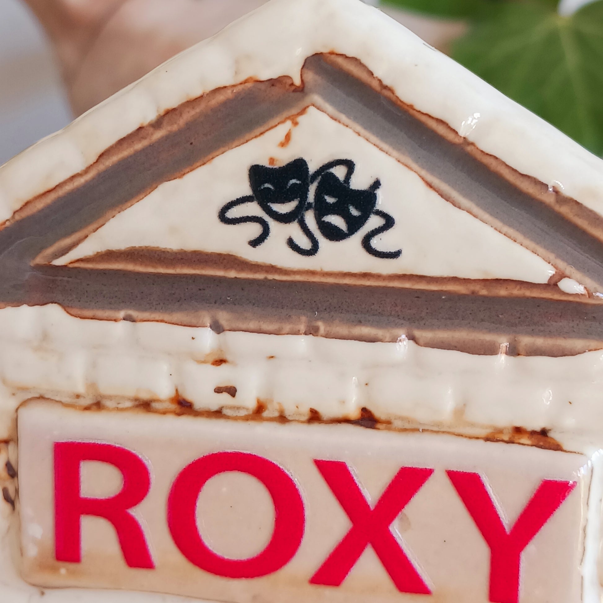 Step into a twilight screening where candlelight flickers like scenes upon an unseen reel. The Shudehill Village Pottery Roxy Cinema tealight house is crafted from ceramic, casting a soft glow through its windows to evoke a nostalgic yet enchanted village night.