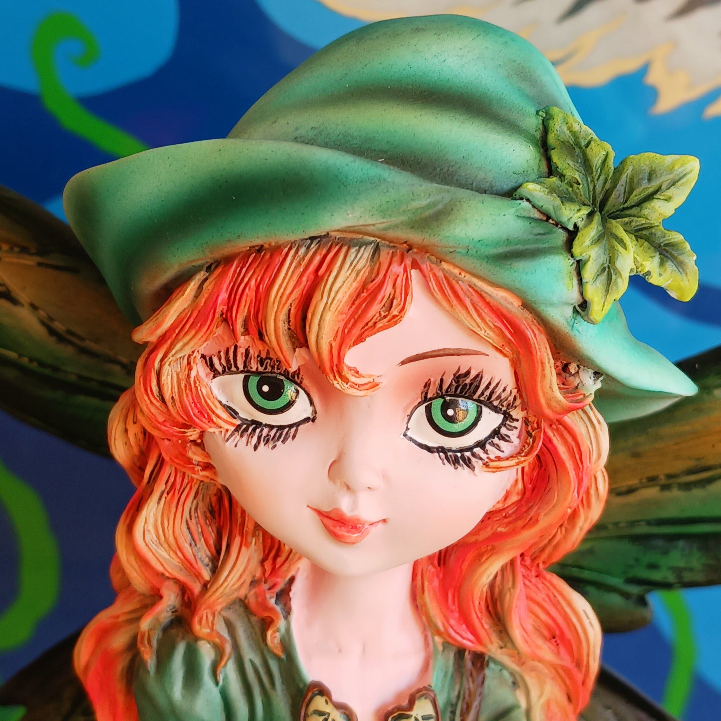Meet Forest Fae, the whimsical guardian of the woods. This stunning standing fairy figurine captures the perfect blend of natural beauty and kawaii charm. Hand-painted with exquisite detail, she wears a lush forest green outfit, accented by leaf-shaped brooches, and holds a mystical staff crowned with a purple jewel. 