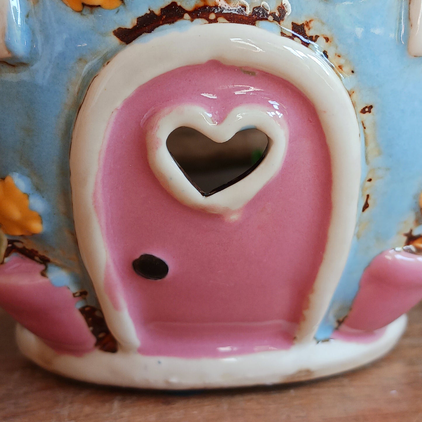 Create a warm and cosy atmosphere in your home with this charming Round Teapot Tealight Holder from the Village Pottery Collection. Crafted in a unique teapot shape, this ceramic tealight holder makes a delightful decorative piece for shelves, windowsills, or side tables. Simply place a tealight inside to enjoy a soft, glowing ambience.