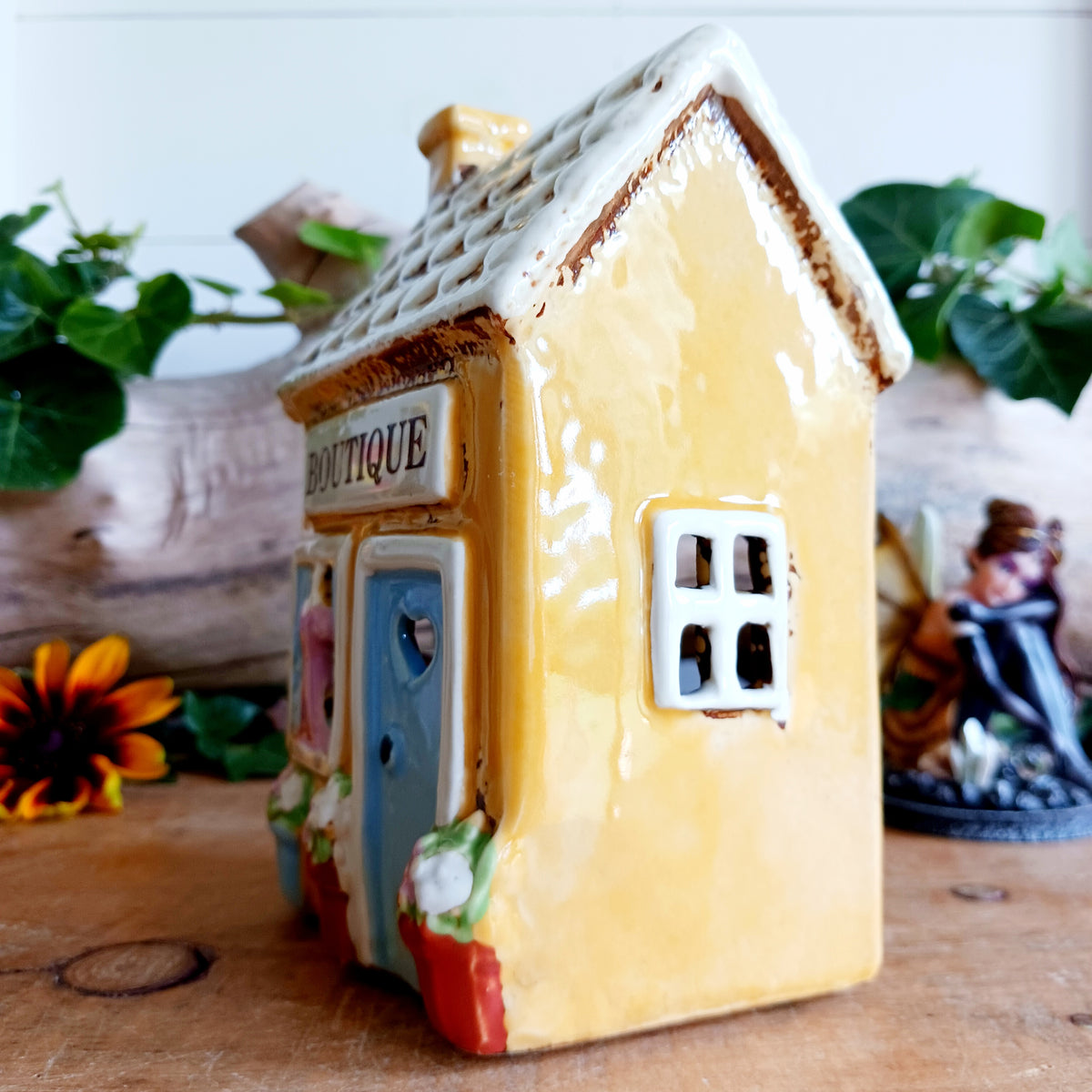 Bring a little village charm into your home with this delightful Village Pottery Boutique Tealight Holder. Hand-crafted in ceramic and beautifully hand-painted, this charming miniature shop makes a lovely decorative feature both with or without a candle.