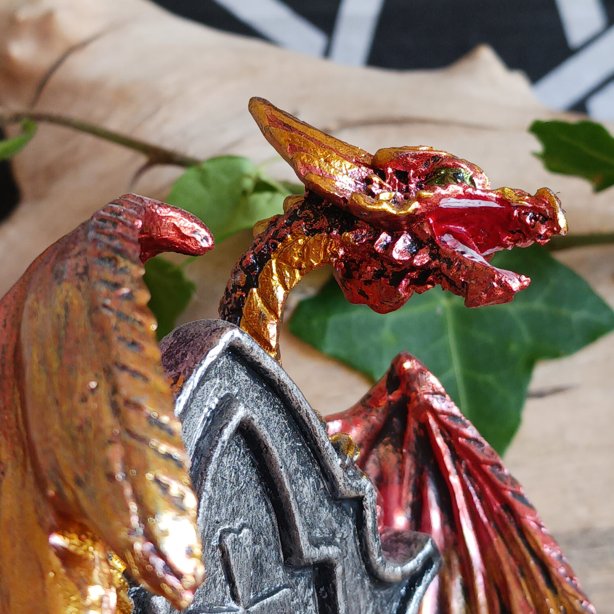 Bring a touch of mythical magic to your home with the Light of the Dragon Red Ornamental Tealight Holder. Featuring an enchanting red dragon coiled around a tombstone-style base, this intricately detailed candle holder is perfect for fantasy lovers and collectors of unusual home décor.