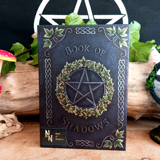 Unlock your inner mystic with this beautifully crafted Embossed Book of Shadows A5 Notebook, designed for those who walk the path of magic, mystery, and self-expression.