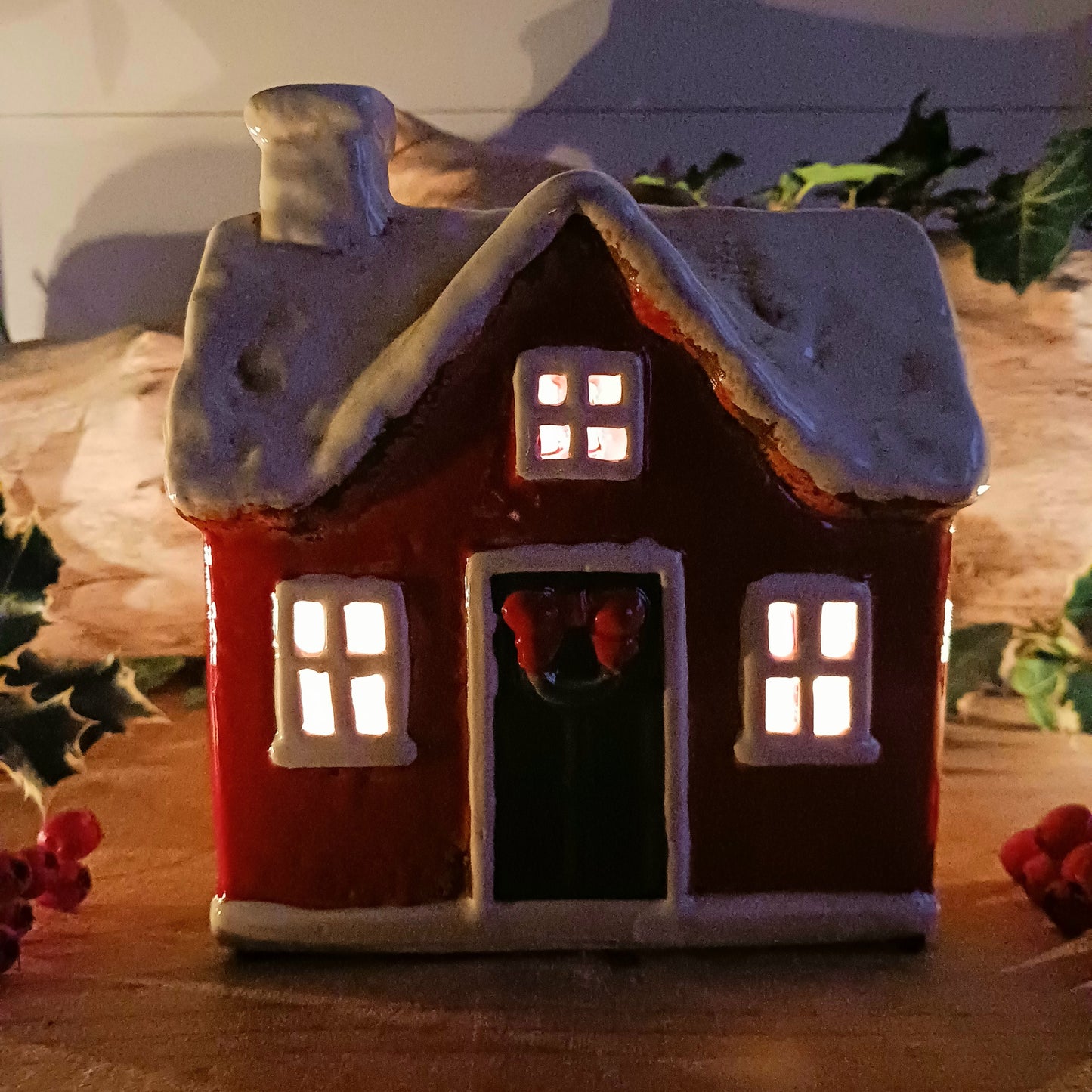 Bring timeless festive charm to your home with this hand-crafted Christmas Traditional House Tealight Holder from The Village Pottery. Carefully shaped in ceramic and finished with rustic detailing, it captures the magic of a snow-covered village scene. 