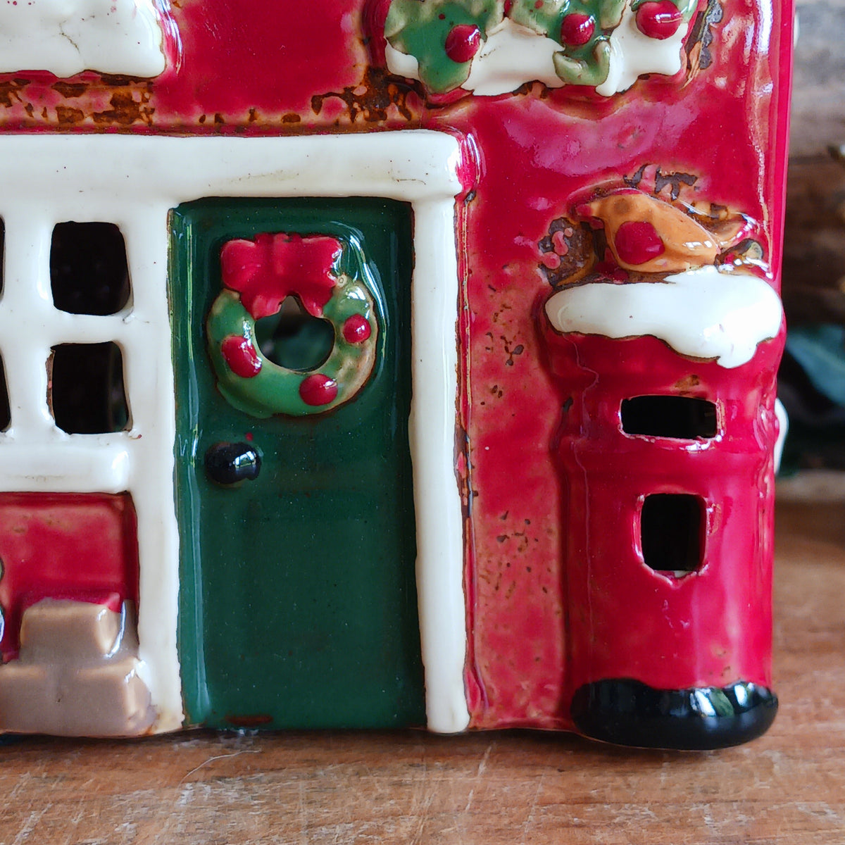 Create a cosy Christmas village scene with this charming Village Pottery Christmas Post Office Tealight Holder. Beautifully detailed as a traditional snowy village post office, it features a snow-covered roof, a post box and a delightful robin decoration for a wonderfully festive look.