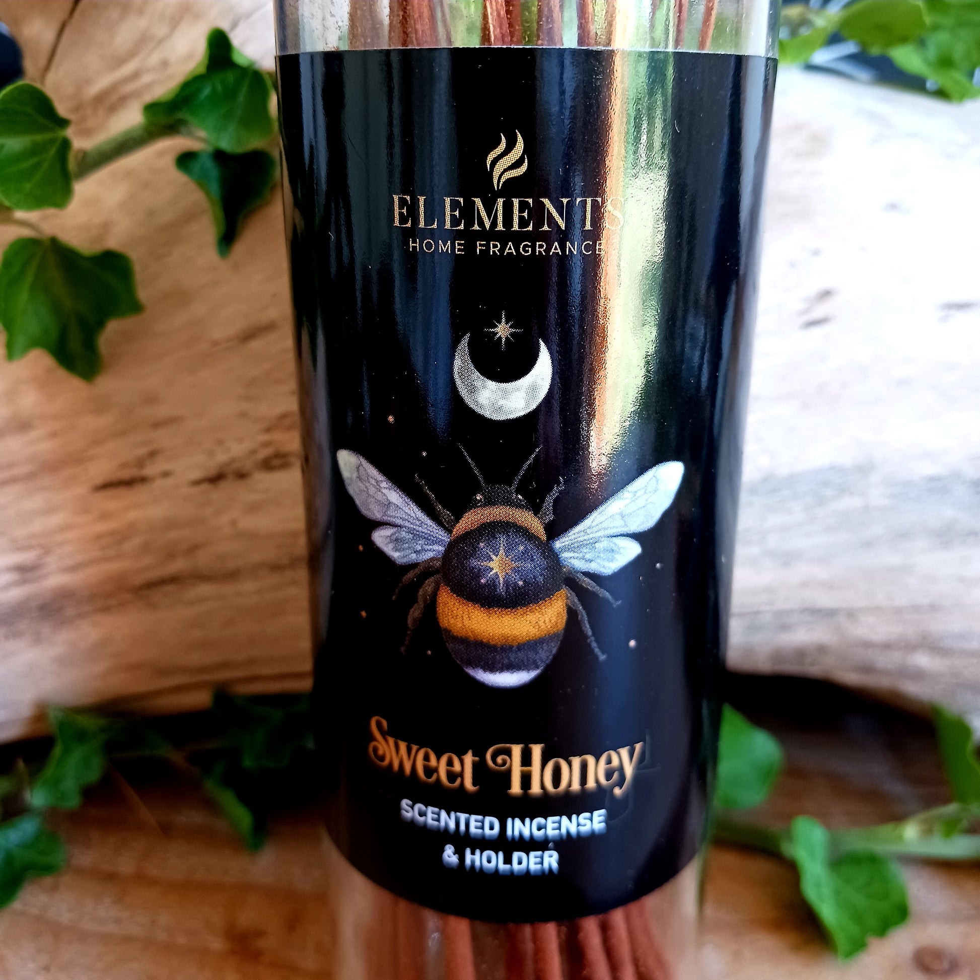 Immerse your senses in the comforting aroma of Dark Forest Sweet Honey Incense Sticks. This set includes 20 high-quality incense sticks with a soothing sweet honey fragrance, known for its calming and cozy properties. Each tube features a mystical forest bee design and comes with a reusable wooden lid that doubles as a practical incense holder. Perfect for meditation, relaxation, or simply adding a warm and inviting atmosphere to your home.