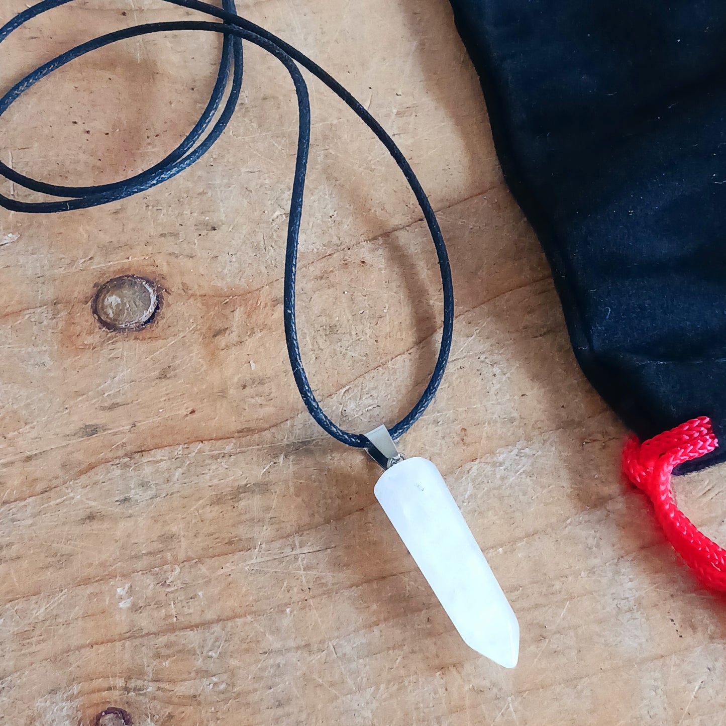 Embrace the natural power of rock crystal with this elegant pendant on a sleek black cord necklace. Known as a master healing stone, rock crystal energises the body, purifies the aura, and enhances inner strength.