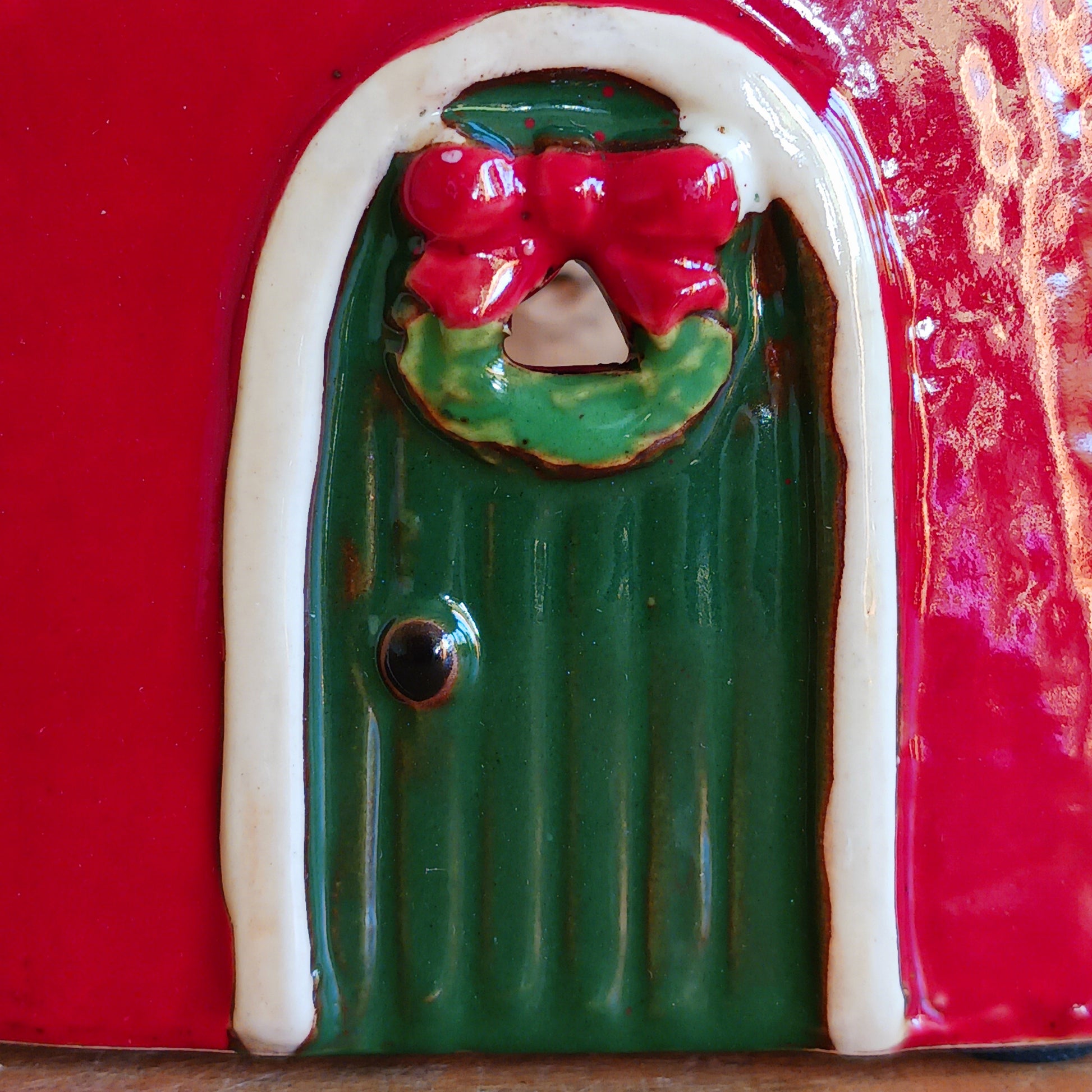 Fill your home with the warmth and wonder of the season with the Village Pottery Christmas Round Window House Tealight Holder, a beautifully handcrafted ceramic creation glowing with festive spirit. Measuring 14.5 x 13.5 x 8.5 cm, this charming house captures the cosy magic of a winter’s night, where light glows softly through the rounded windows like starlight in the snow.