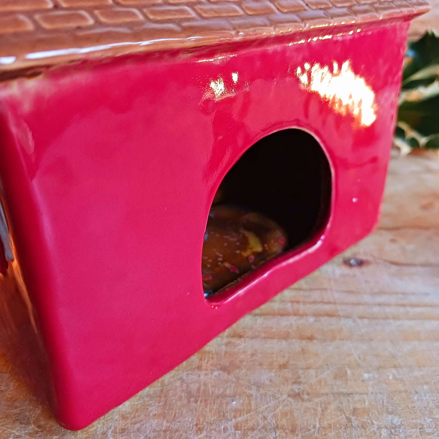 Bring nostalgic festive charm to your home with our Christmas Toy Shop Ceramic Tealight Holder, handcrafted in the Village Pottery workshop. This detailed tealight house captures the magic of an old-world toy shop on a snowy winter’s evening. 