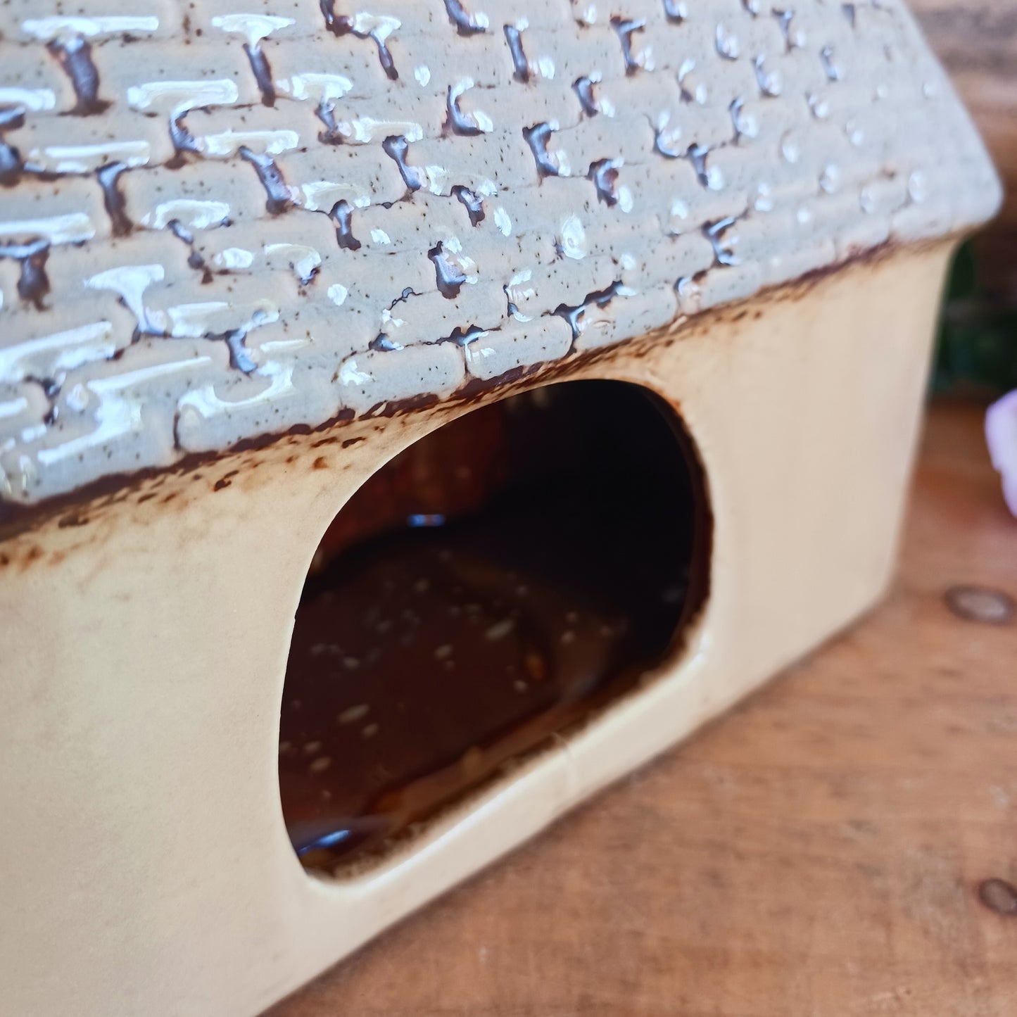 A welcoming glow awaits within this Village Pottery Bed & Breakfast Tealight House, where candlelight flickers through tiny windows like a hearth lit for wandering souls. Crafted from ceramic, this charming inn captures the spirit of an enchanted village, inviting warmth, stillness, and quiet magic into your space.
