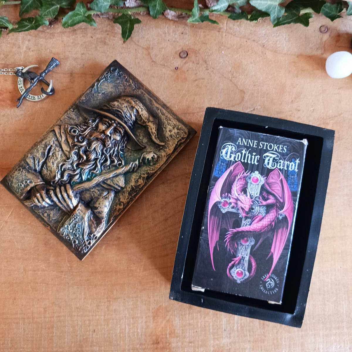 Bring a little magic and mystery into your home with the enchanting Wizard’s Hoard Box. Featuring a beautifully sculpted wizard clutching a magical staff, this decorative trinket box is surrounded by intricate mystical detailing and finished in a rich, antique gold-like colour.