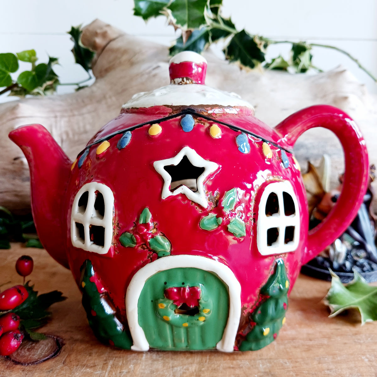 Add a touch of charm and character to your festive display with the Village Pottery Xmas Teapot House Tealight. Combining the familiar shape of a traditional teapot with the appearance of a miniature Christmas house, this unusual decorative tealight holder makes a delightful addition to your seasonal décor.