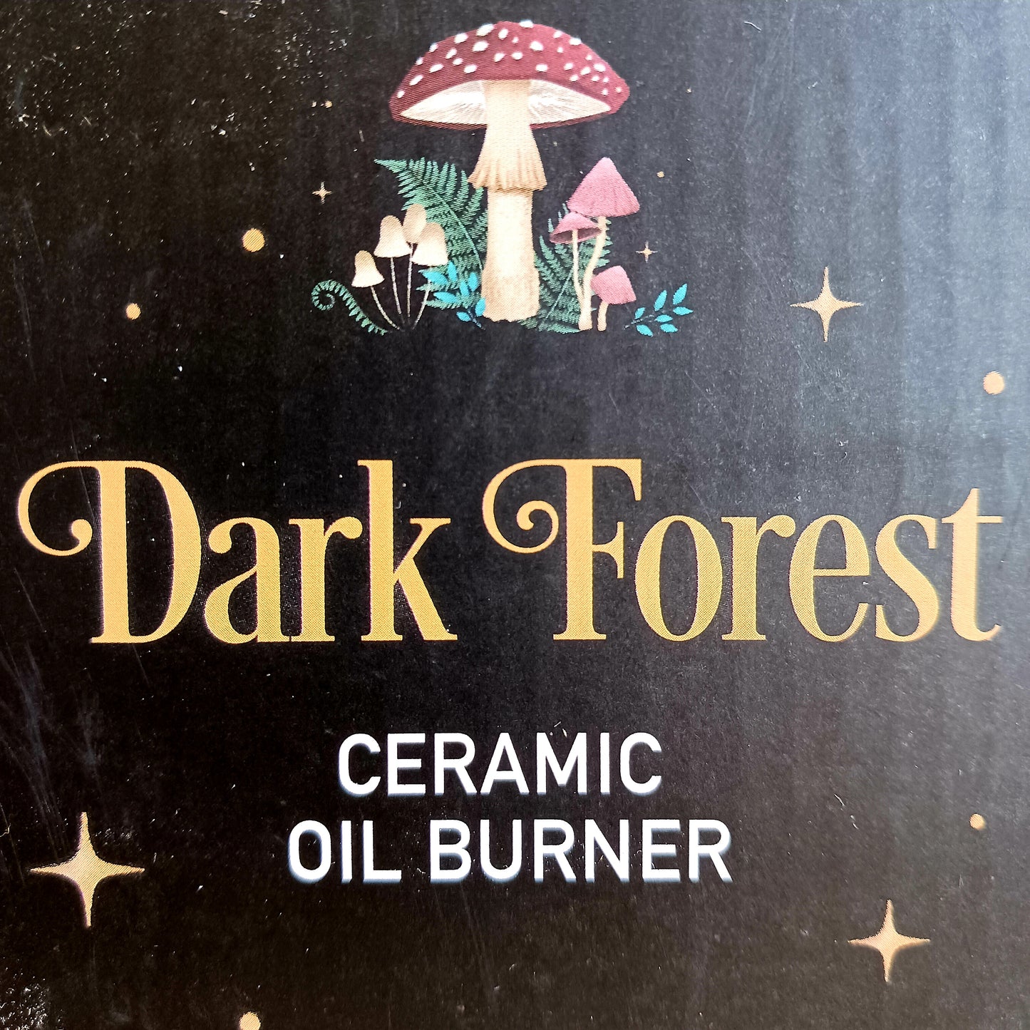 Transform your space into a magical woodland retreat with this beautifully designed dark forest oil burner. Featuring a rich black finish adorned with vibrant illustrations of flora and fauna, this enchanting piece comes to life when lit, casting a warm, ambient glow reminiscent of moonlit nights beneath the stars.