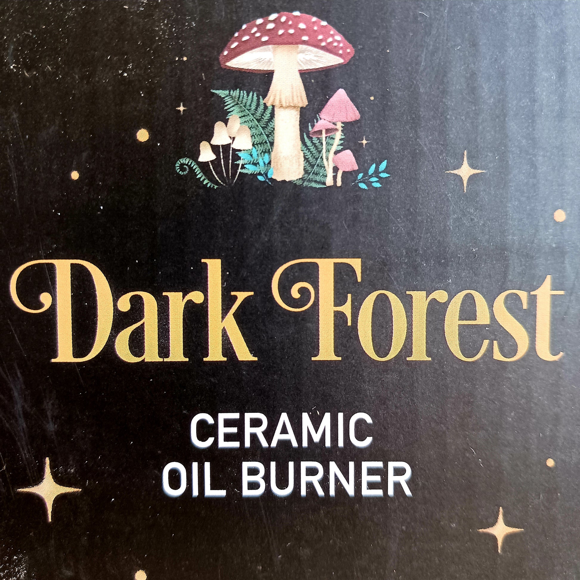 Transform your space into a magical woodland retreat with this beautifully designed dark forest oil burner. Featuring a rich black finish adorned with vibrant illustrations of flora and fauna, this enchanting piece comes to life when lit, casting a warm, ambient glow reminiscent of moonlit nights beneath the stars.