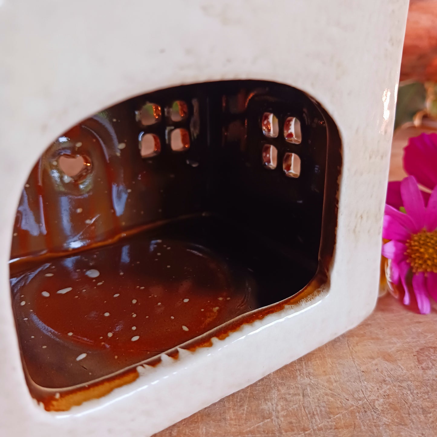 Handcrafted in the Village Pottery workshop, this Florist Tealight Holder is a true collectible from the Shudehill Collection. Made from fine ceramic with intricate detailing, it captures the nostalgic charm of a festive florist shop in a snow-dusted winter village scene.