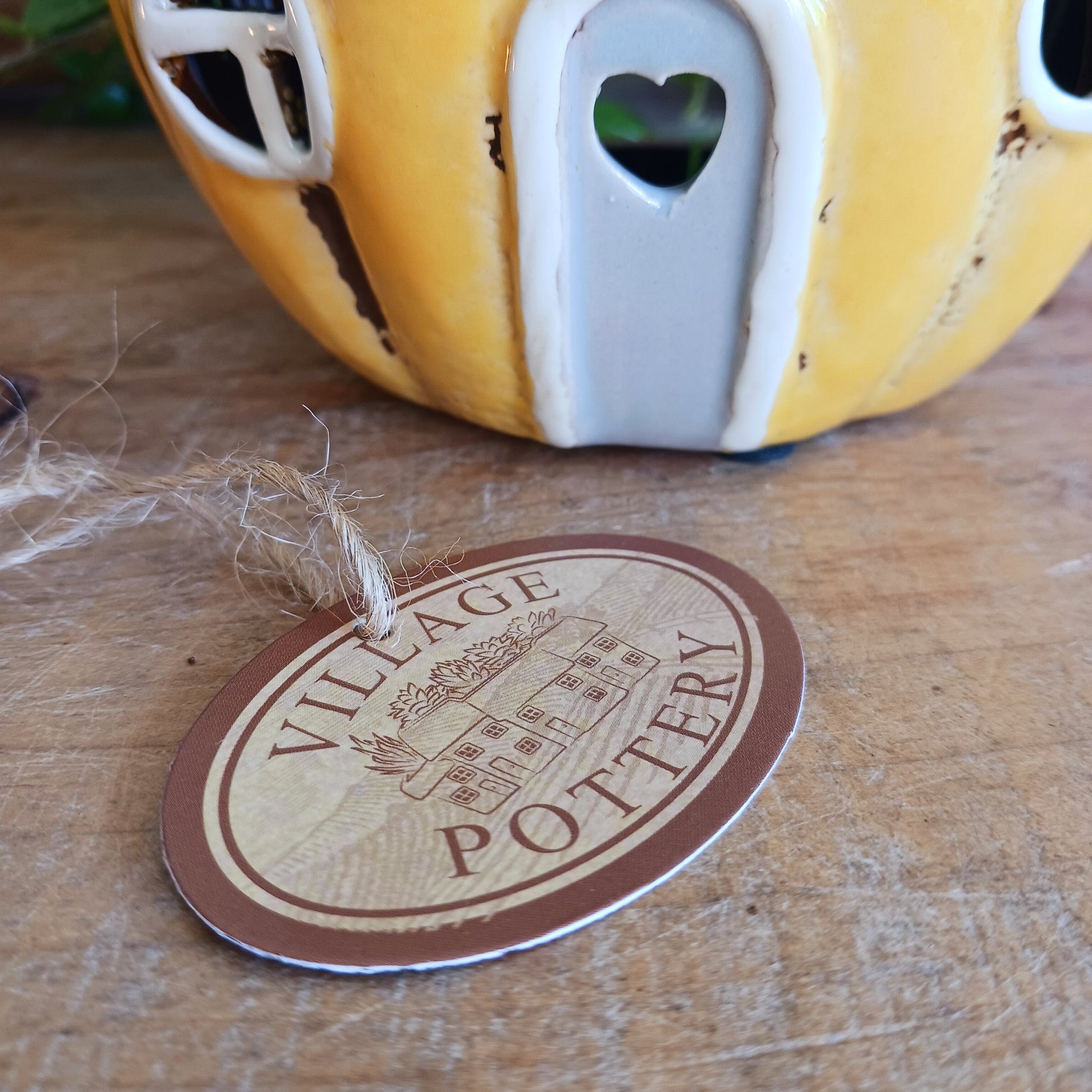 Invite a little woodland wonder into your home with the Village Pottery Pumpkin House Tealight Holder, a delightful hand-painted creation in a soft yellow ceramic glaze. Measuring 17 x 13 x 11 cm, this fairy-tale pumpkin cottage glows beautifully when lit, filling your space with warmth, light, and a touch of enchantment.