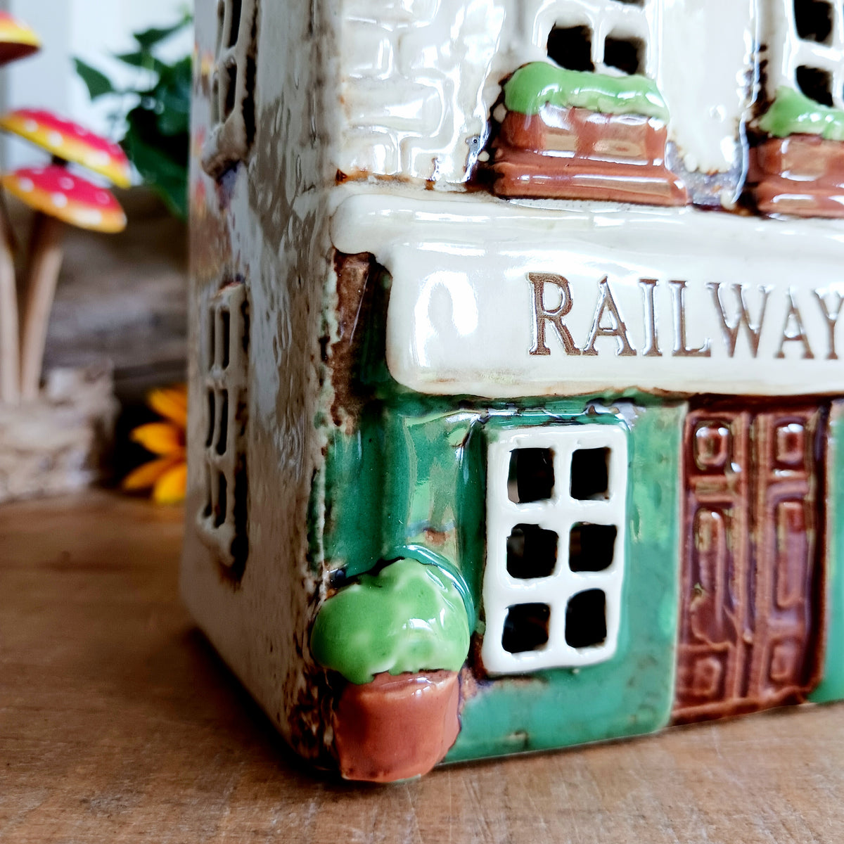 Bring a little British village charm into your home with this delightful Village Tavern Tealight Holder, beautifully hand-crafted in ceramic and hand-painted with charming, characterful details.