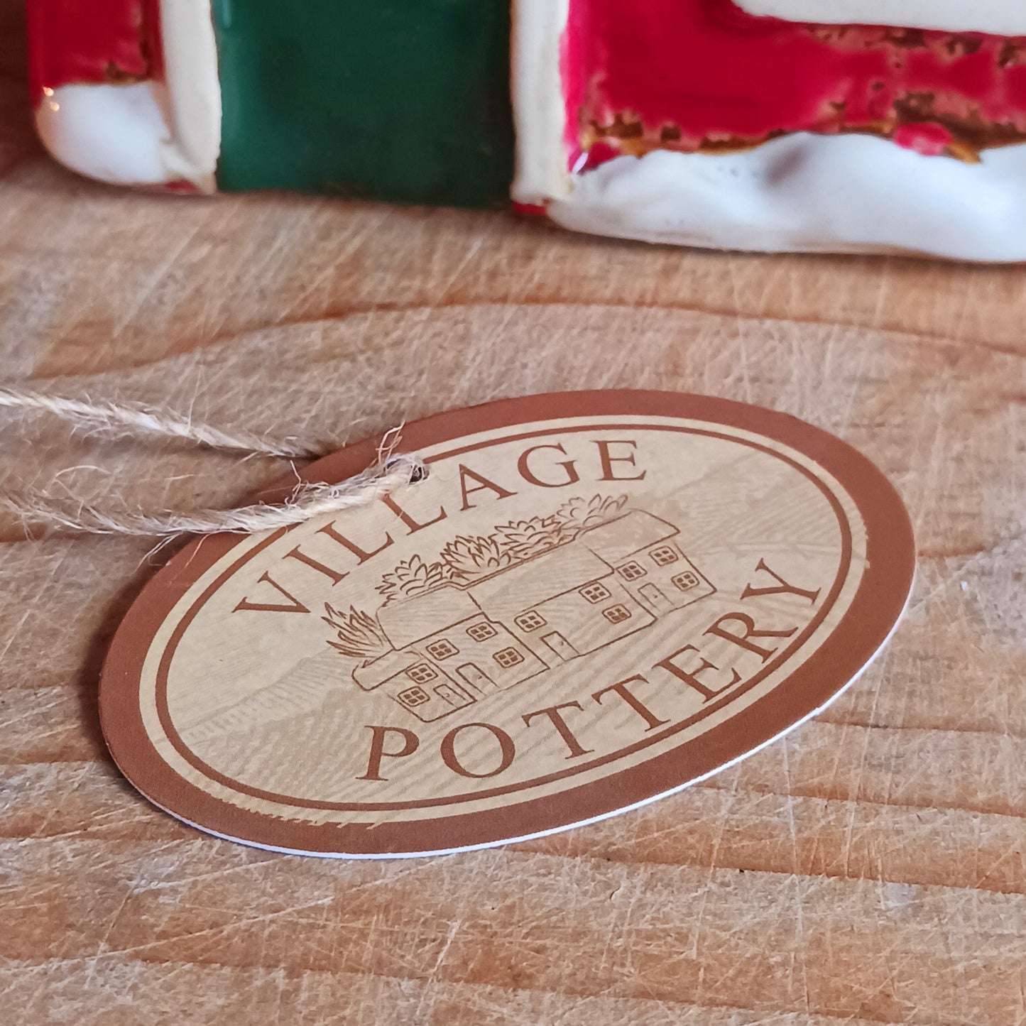 Bring the warmth and magic of Christmas into your home with this handcrafted Christmas Wreath House Tealight Holder from the Village Pottery collection. Made from high-quality ceramic and decorated with a classic wreath and rustic detailing, this piece evokes the charm of a snowy winter’s evening.